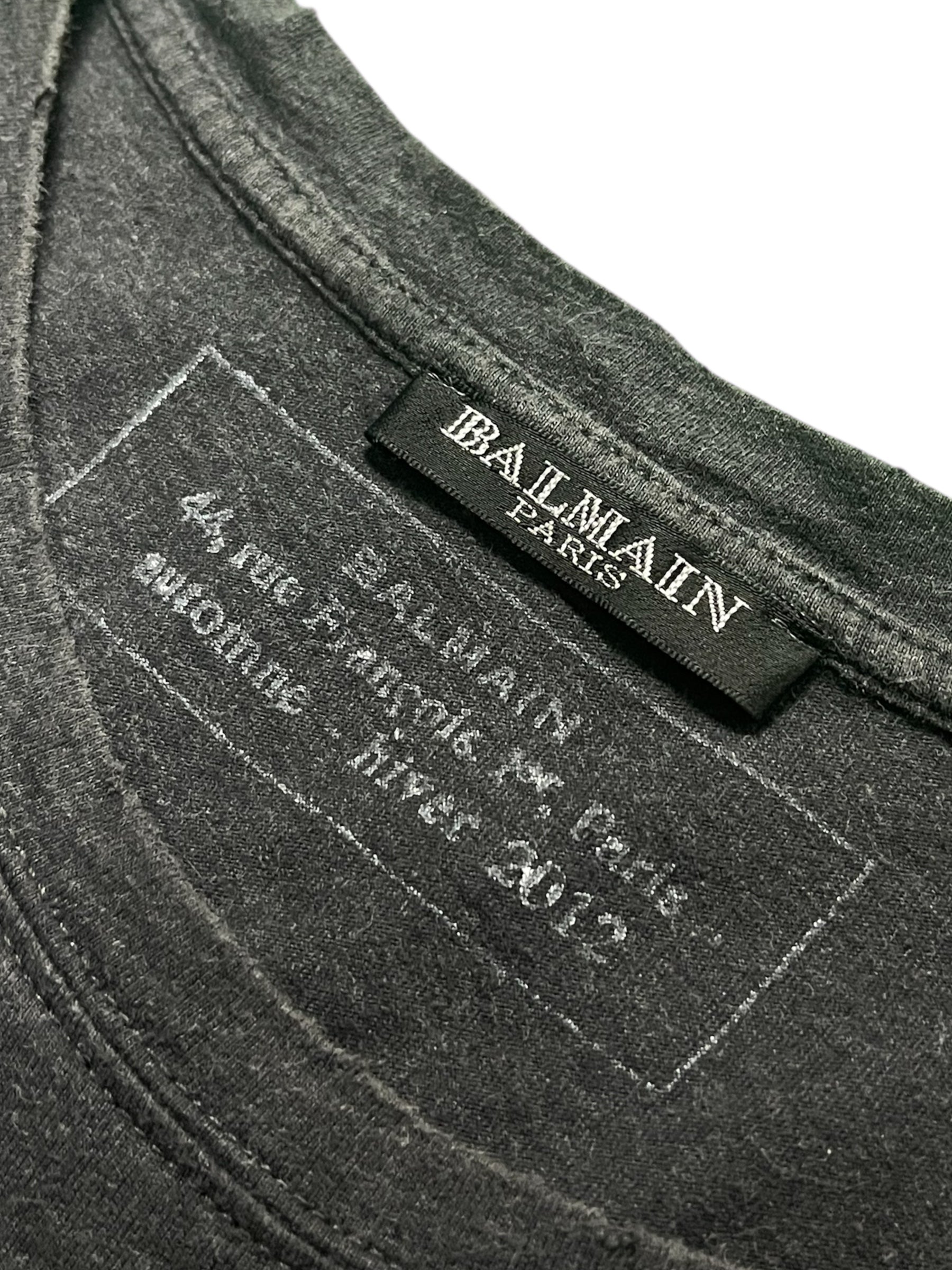 Balmain AW12 distressed T-shirt with ripped details and casual fit, displayed on a plain background.