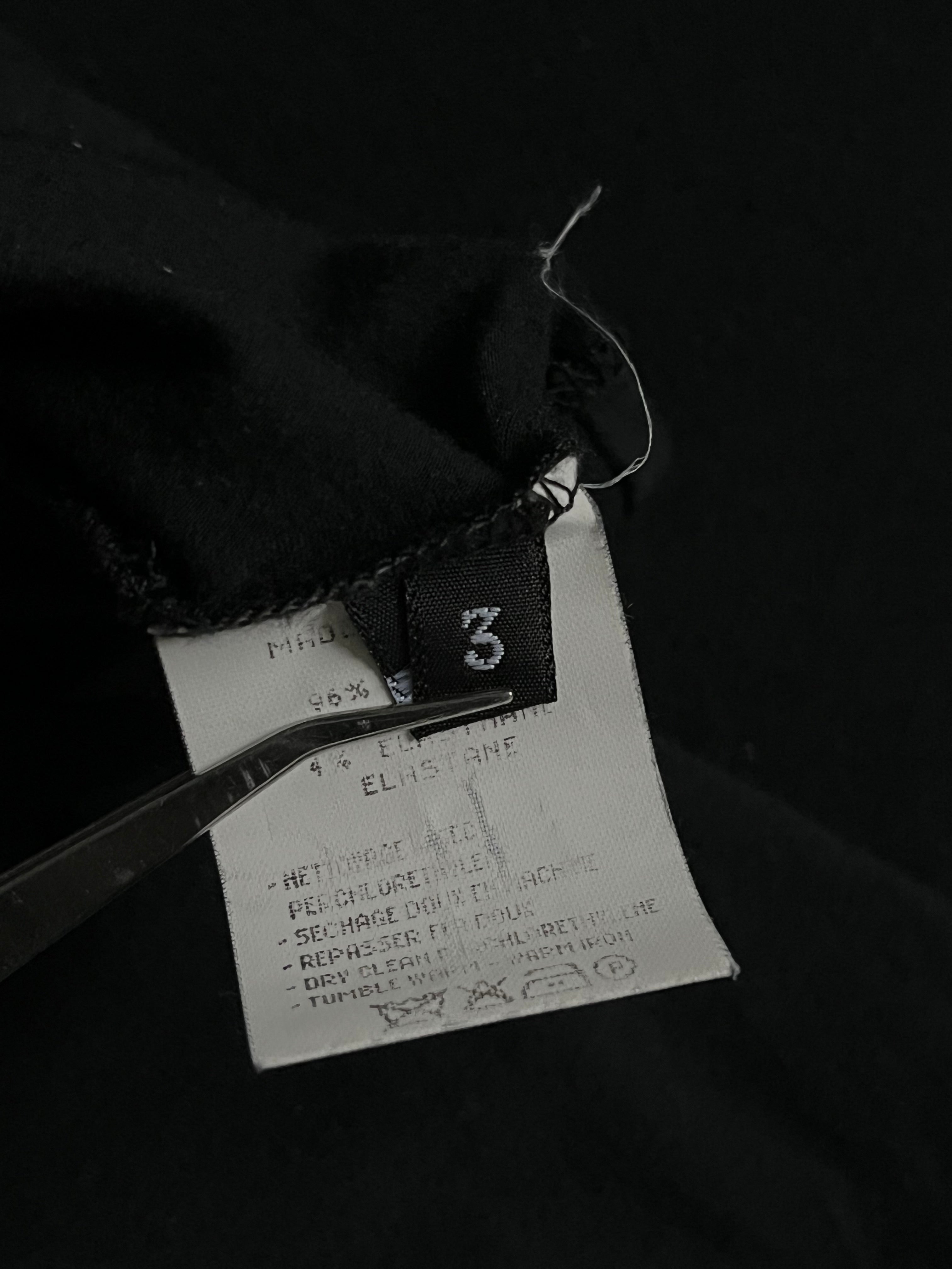 Navy Yohji Yamamoto tank top displayed on a model, showcasing its sleek design and minimalist style.