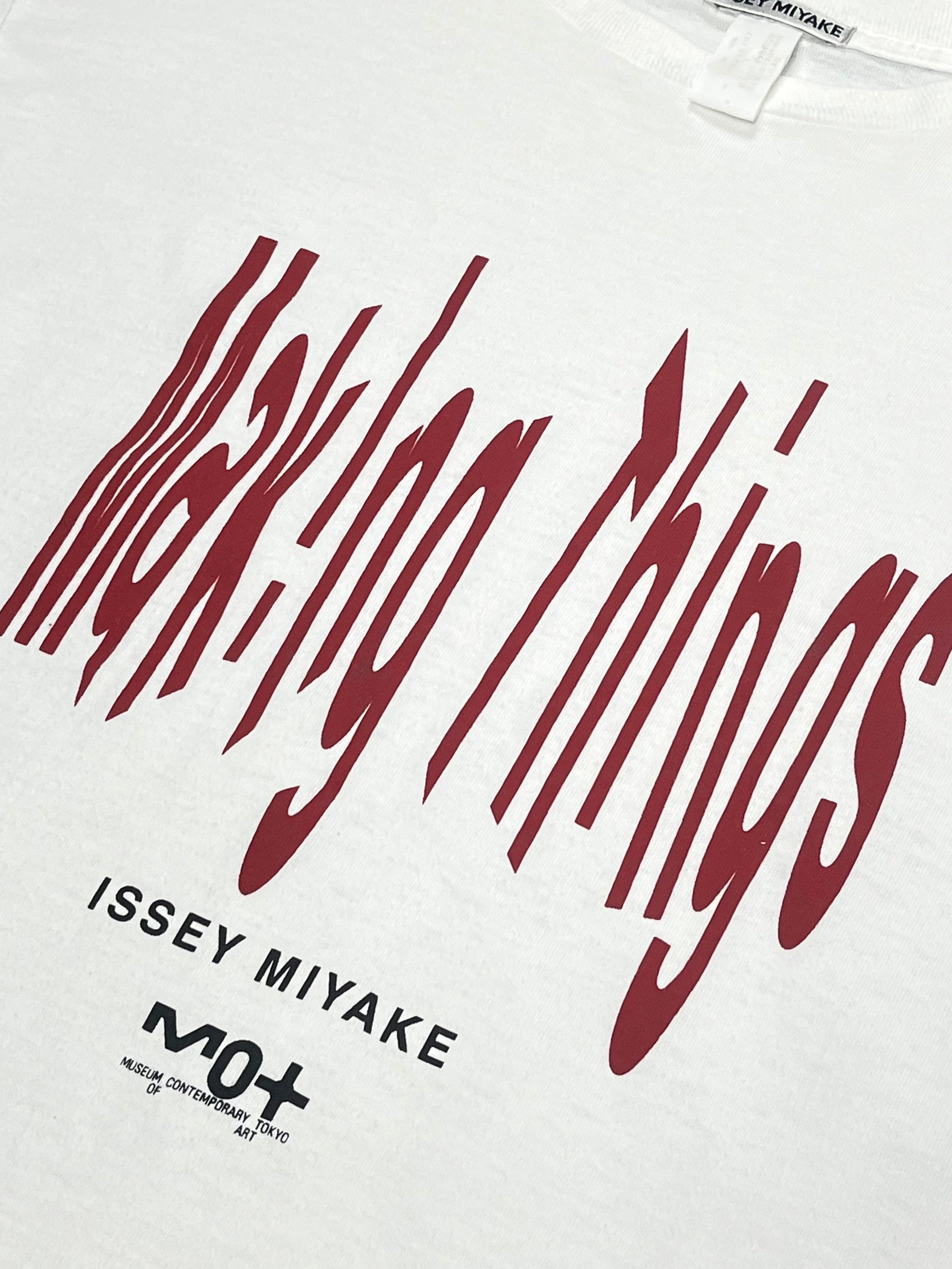 Issey Miyake SS99 Making Things Promo T-shirt in black, featuring graphic print and casual fit displayed on a hanger.