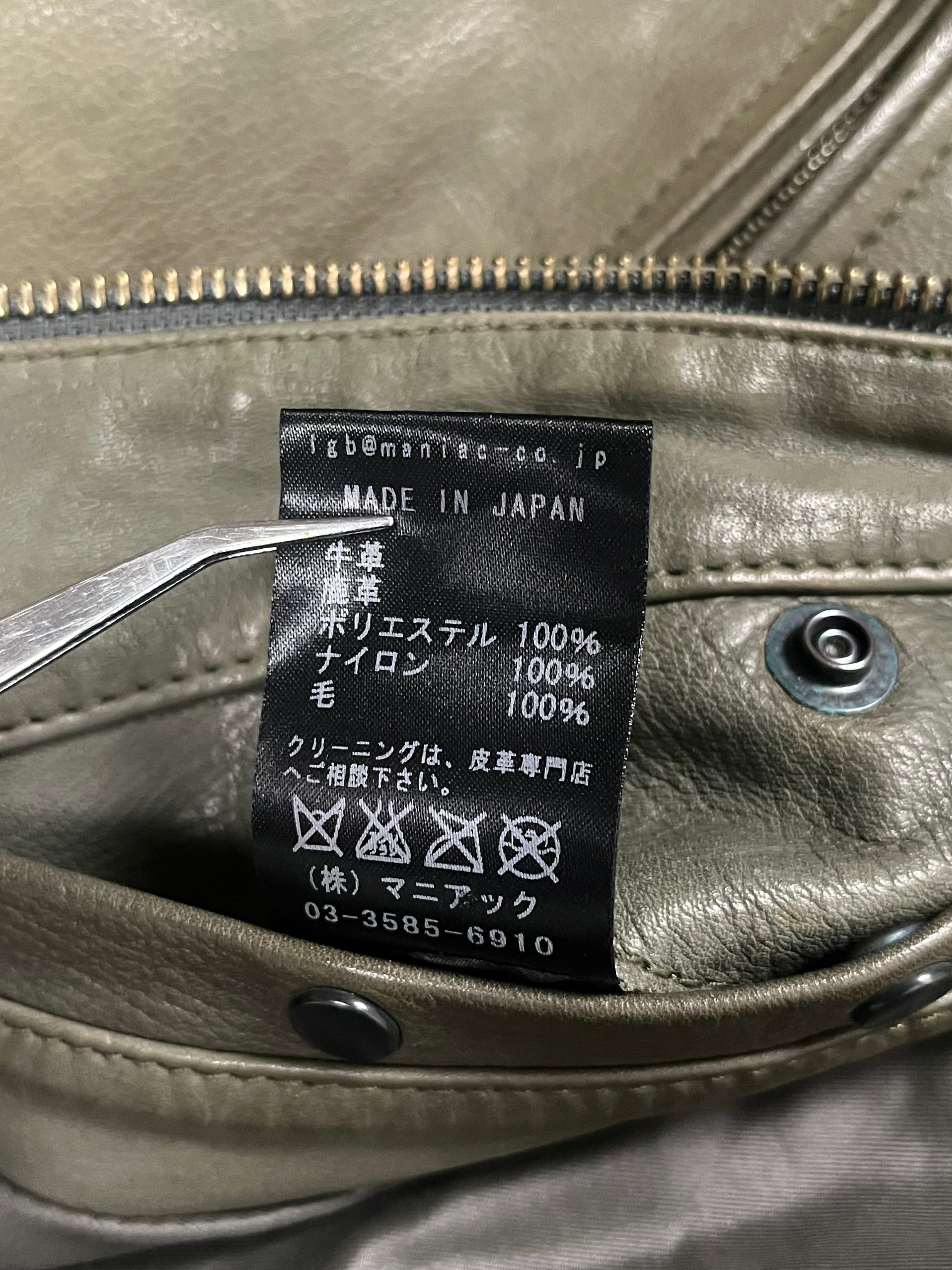 Le Grande Bleu Bono green leather jacket, classic 00s style, shown on a hanger with detailed stitching and smooth leather finish.