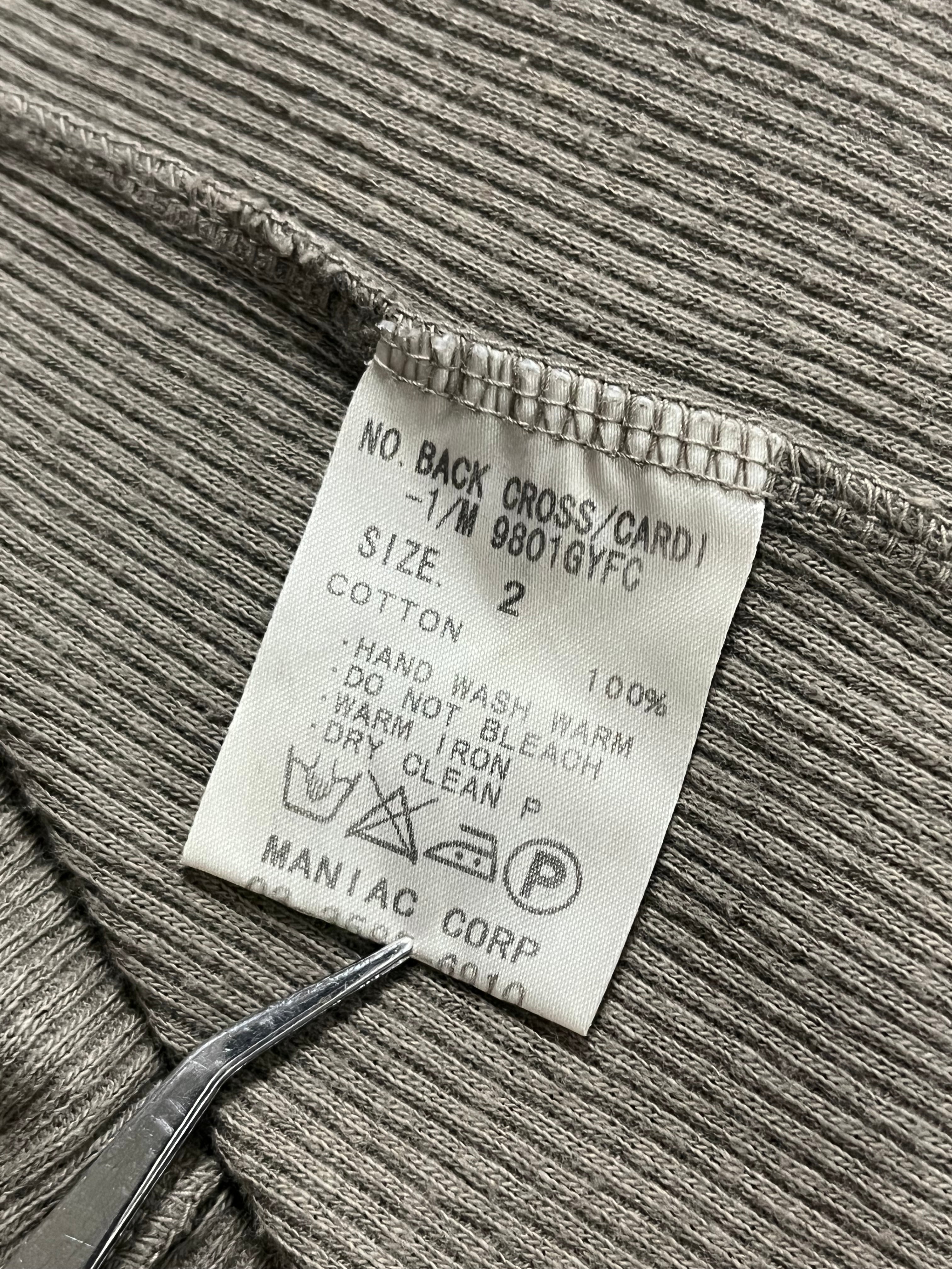 Le Grande Bleu 00s Back Cross Cardigan showing a stylish knit cardigan with back cross design in neutral tones.