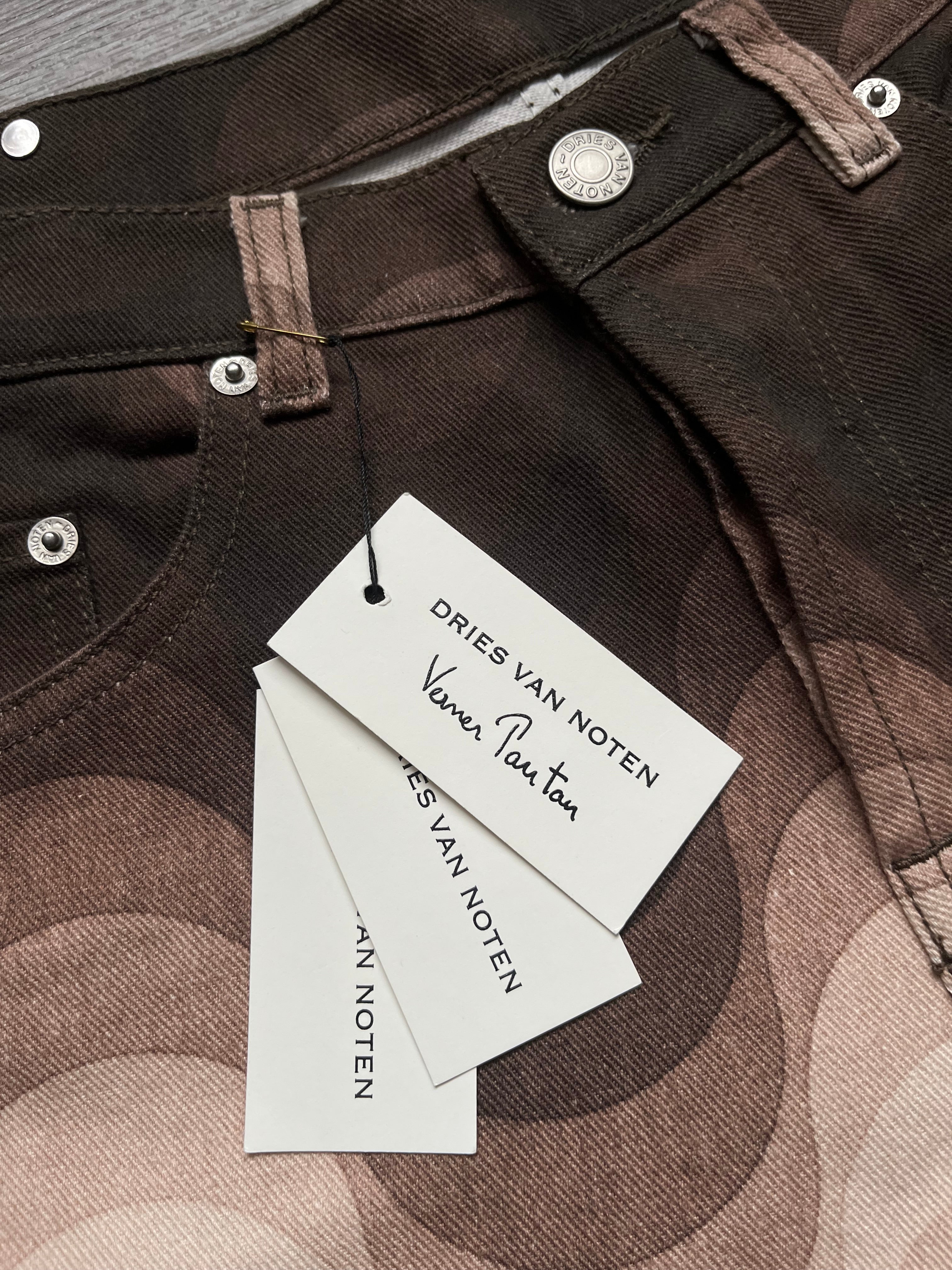 Dries Van Noten SS19 Verner Panton denim pants with relaxed fit and classic blue wash, displayed on a hanger.