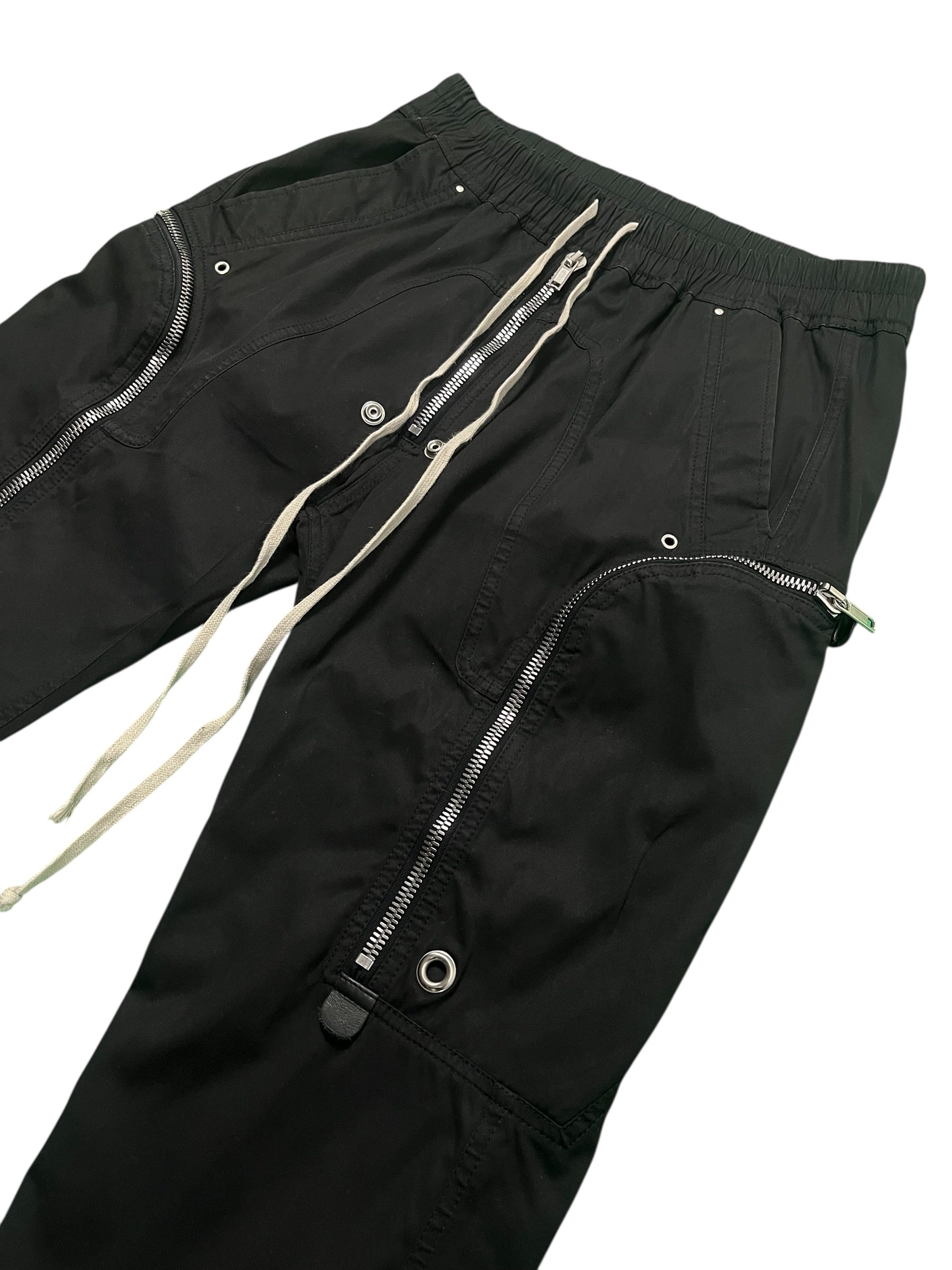 Rick Owens FW23 Luxor Bauhaus Cargo Jogger Pants in black with multiple pockets and relaxed fit, casual streetwear style.