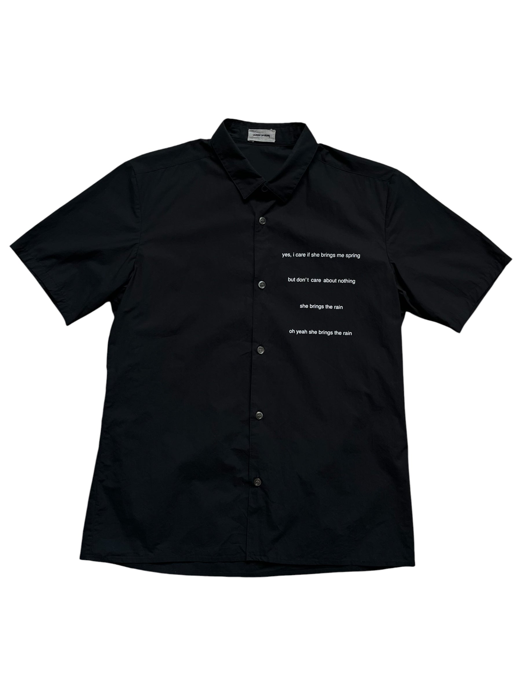 Undercover SS12 "Openstrings" She Brings The Rain shirt, stylish casual shirt with open string details, black fabric, and modern design