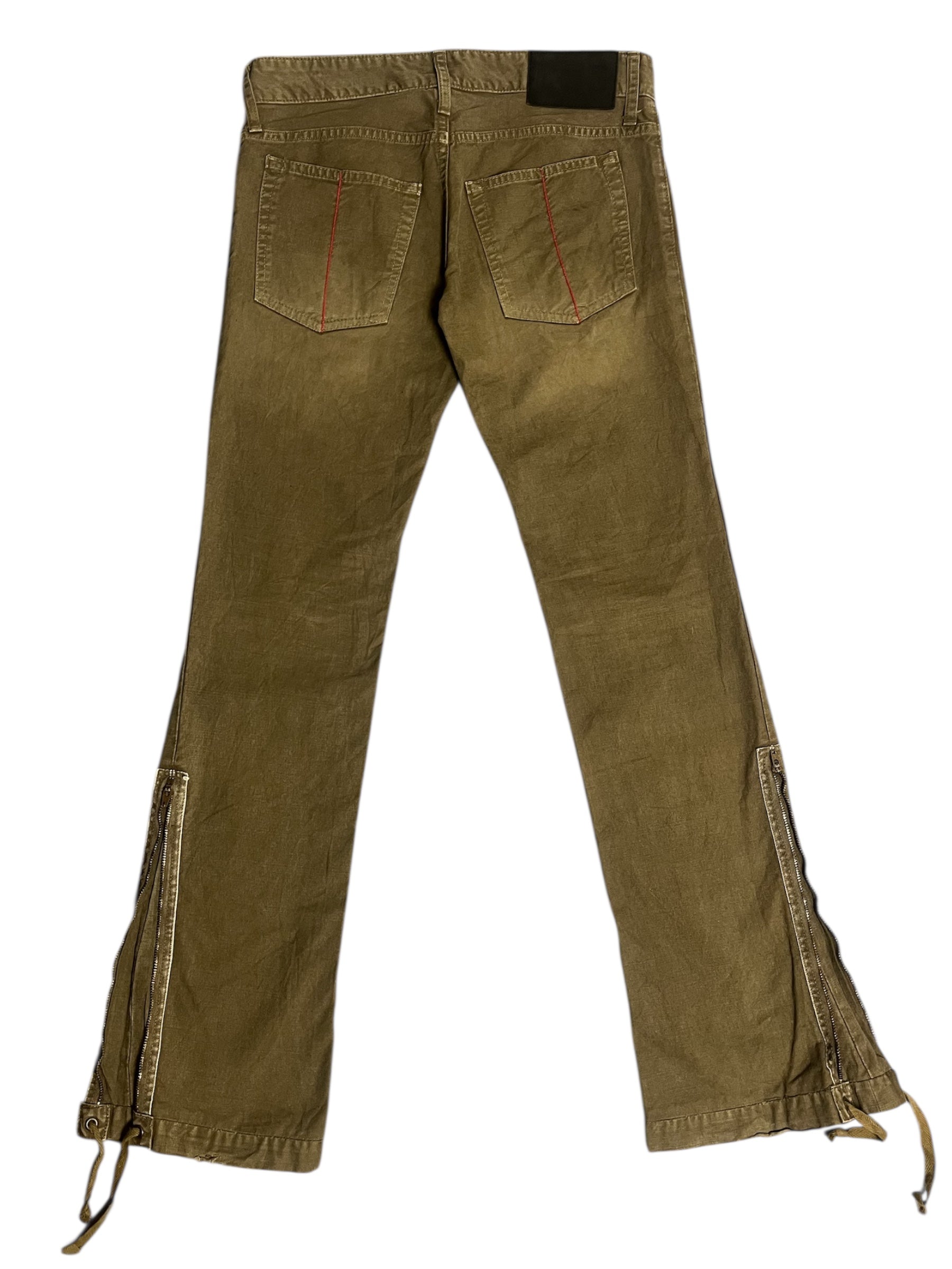 Le Grande Bleu 00s Wolf Flared Zip Pants showing high-waisted style with zipper details and flared leg design.