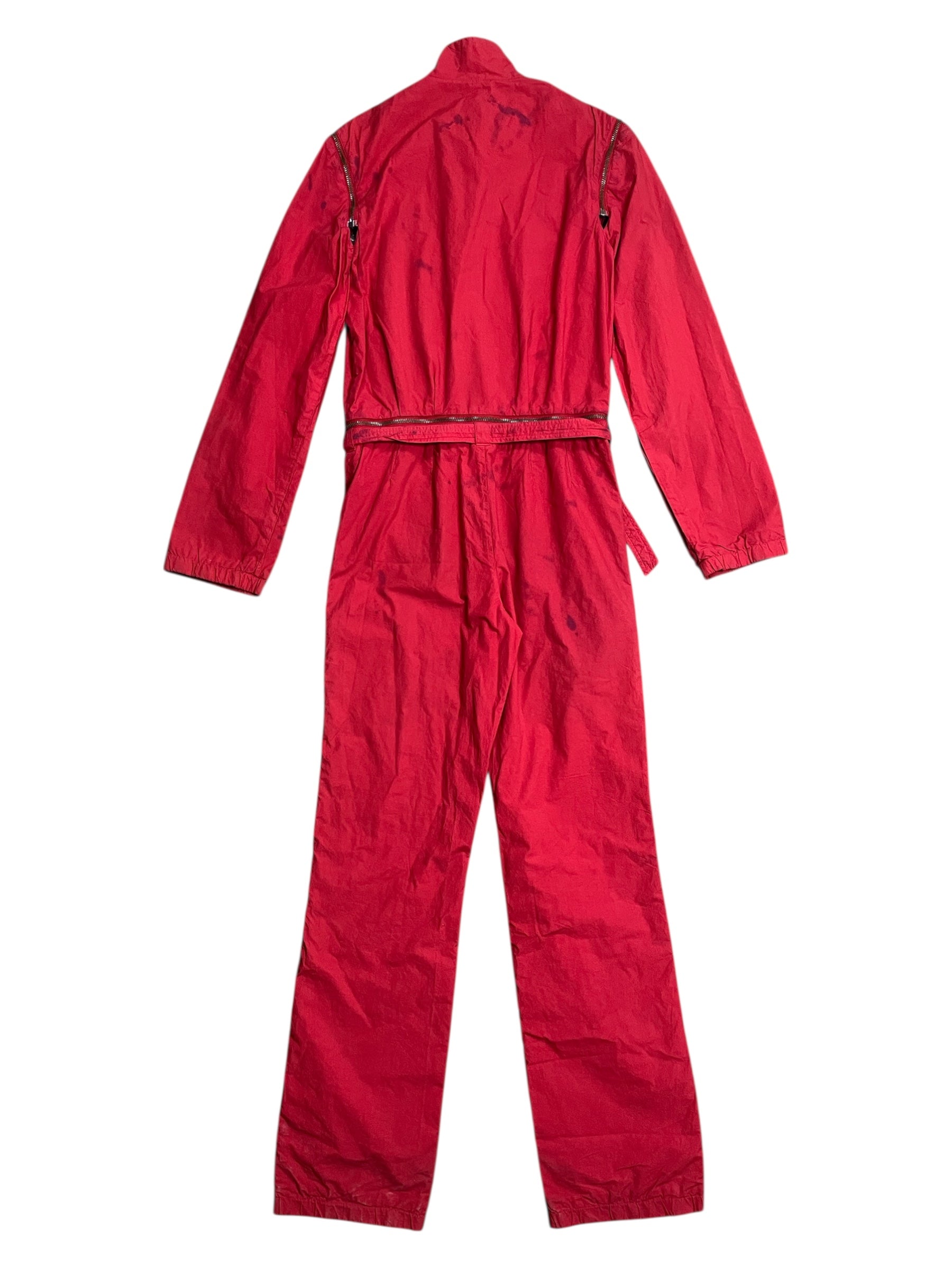 Raf Simons SS02 "Woe Onto Those" red boiler suit coverall with front zipper and utilitarian design on a mannequin.