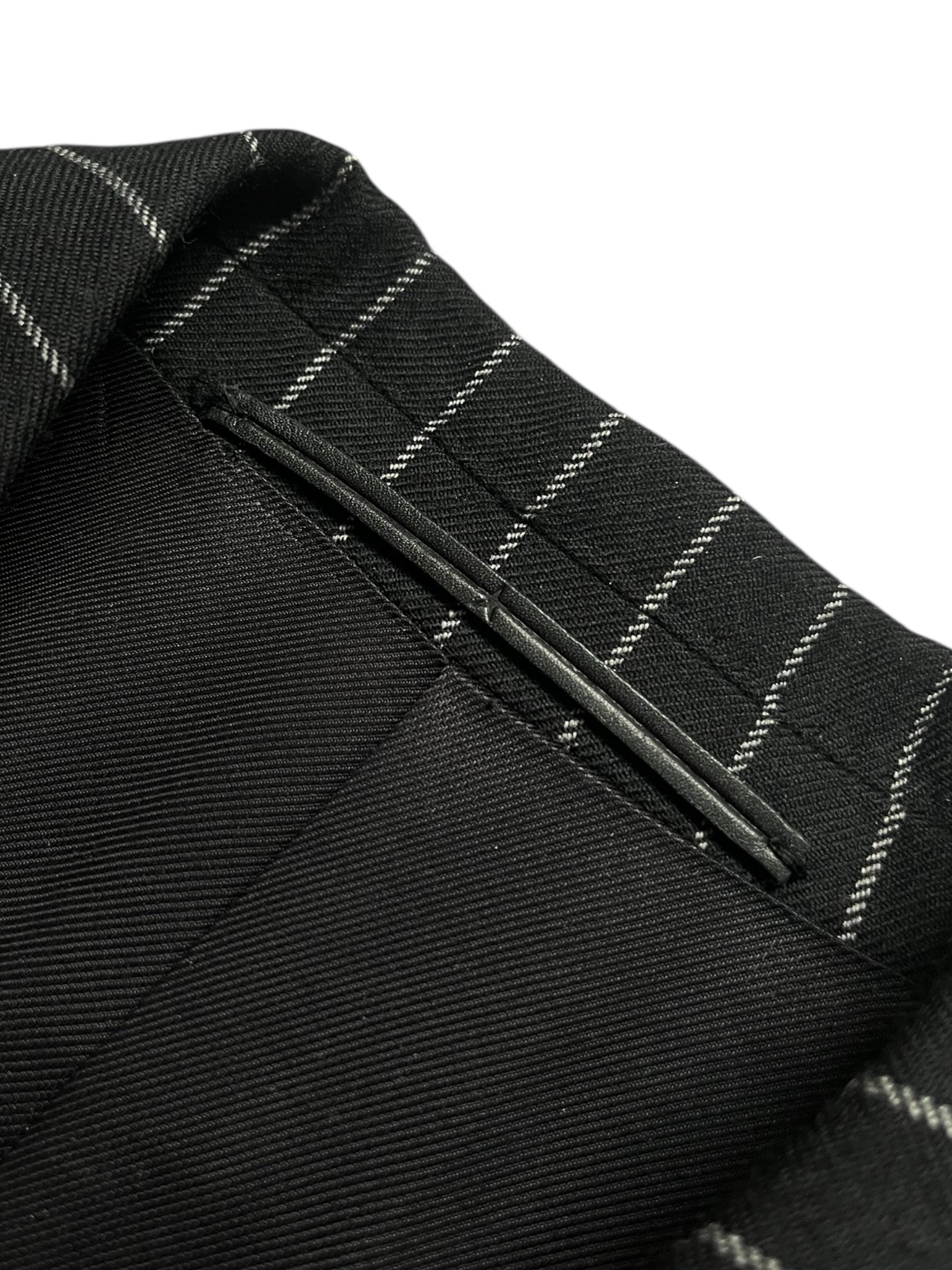 Givenchy FW15 distressed wool trench coat with a rugged, worn-in look and classic design, shown on a hanger.