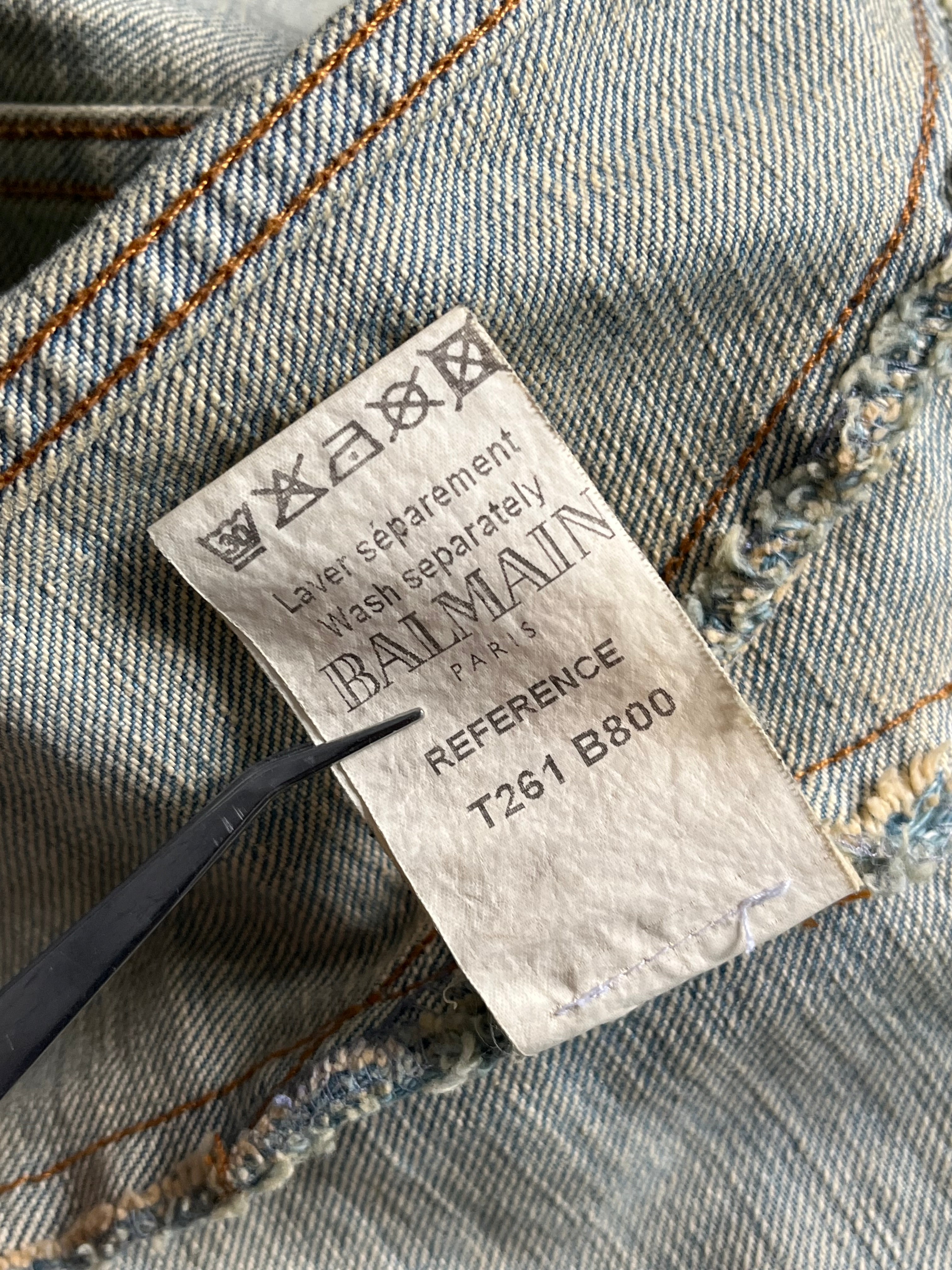 Balmain SS12 G-Dragon Mud Wash Denim Jacket showing distressed denim fabric and classic jacket design.