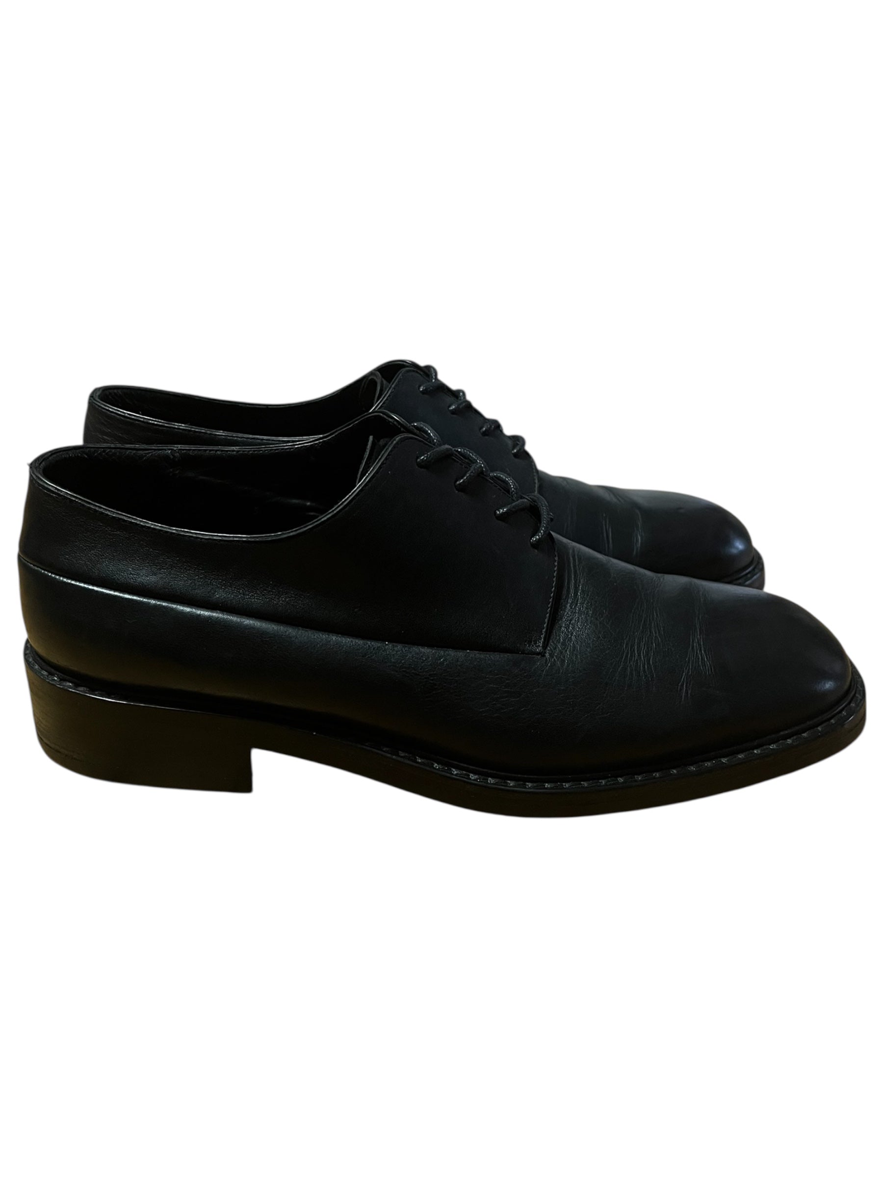Black leather Dior derbies shoes with sleek design and polished finish, showcasing elegant men's footwear.