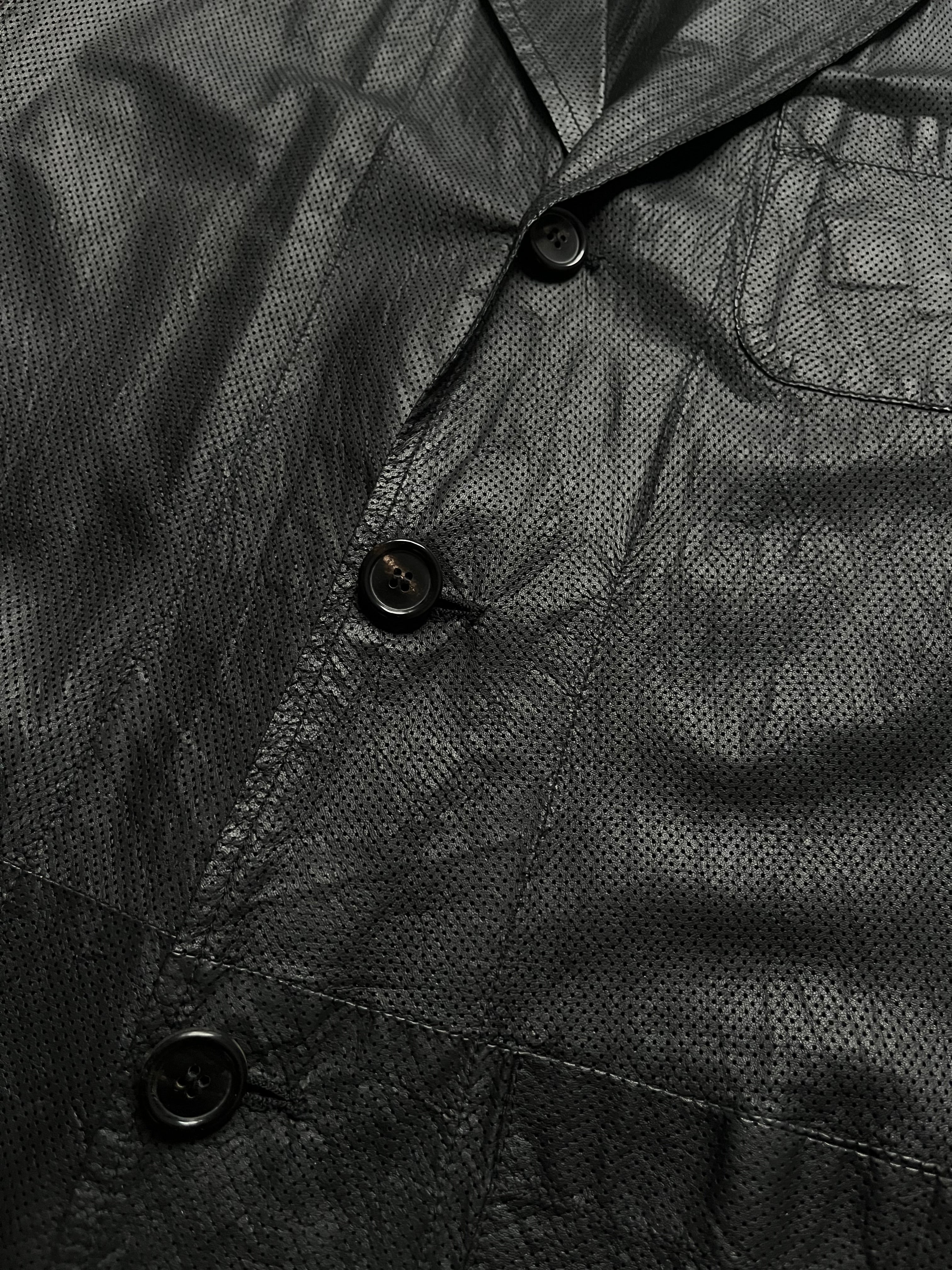 Ann Demeulemeester perforated lambskin blazer with a tailored fit and stylish design, shown on a model.