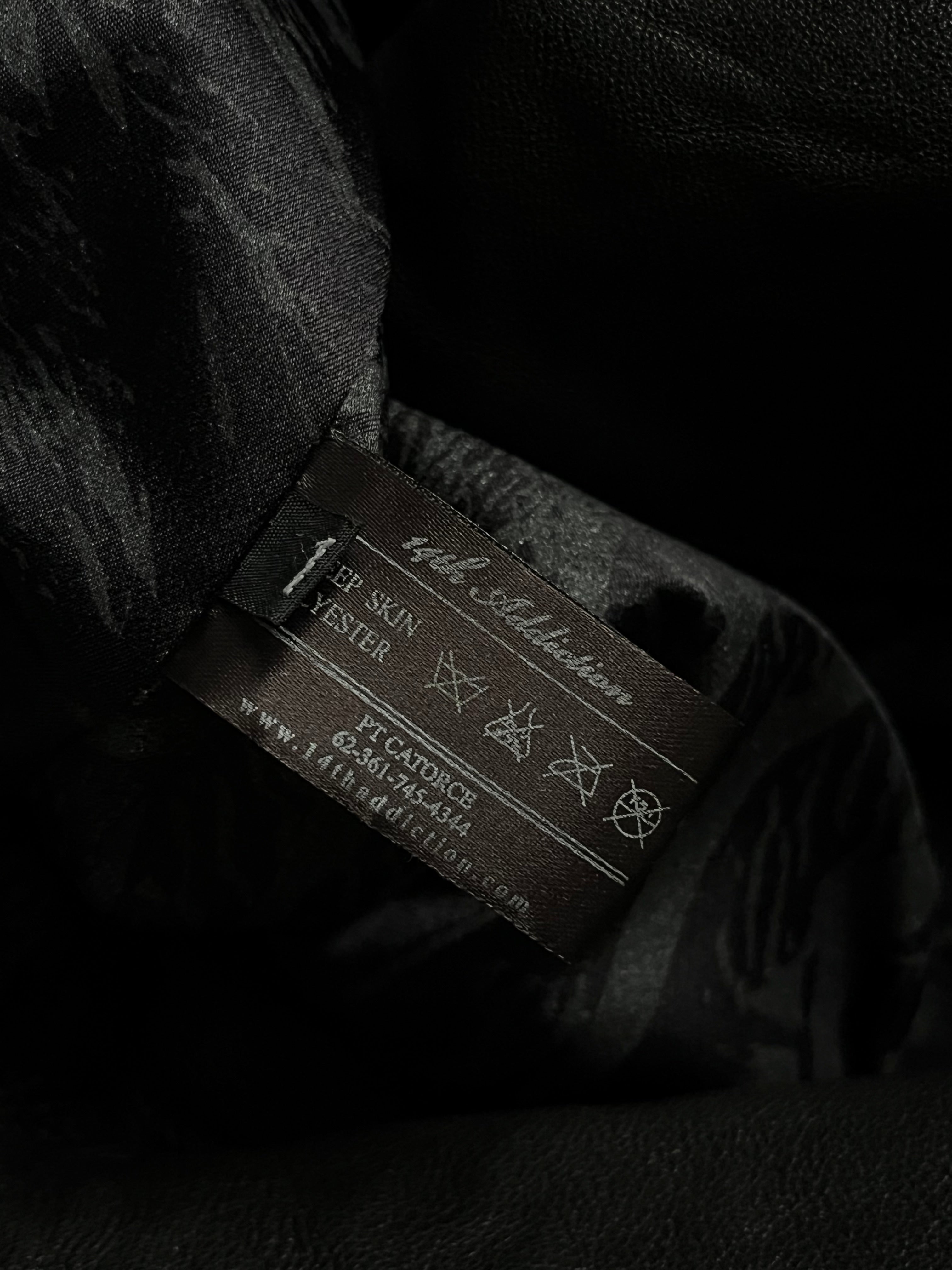 Black sheepskin jacket with cross-zip design from 14th Addiction, showcasing a stylish and textured outerwear piece.