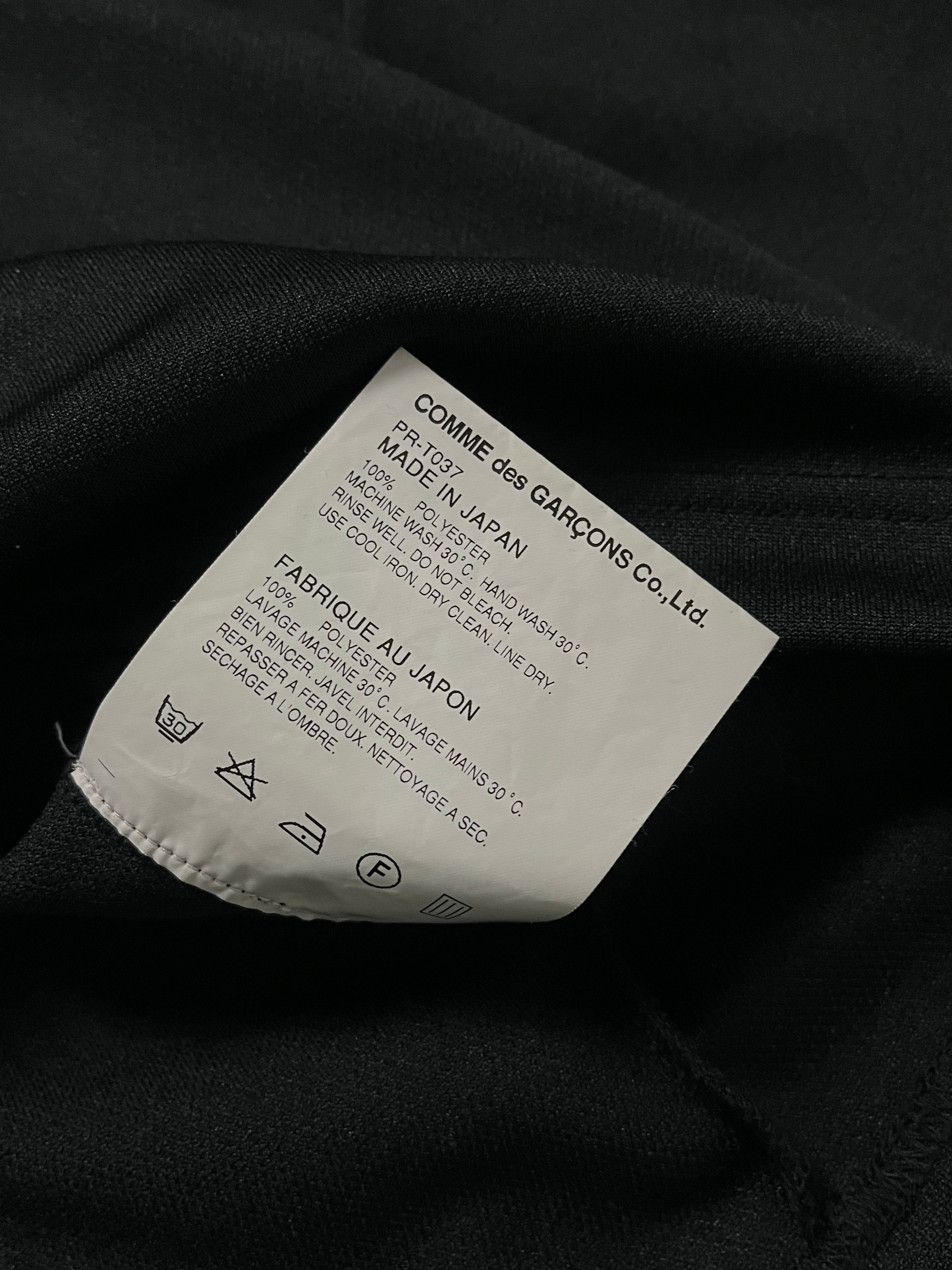 Comme des Garçons Homme Plus Armour Of Peace studded longsleeve shirt with detailed metal embellishments and black fabric.