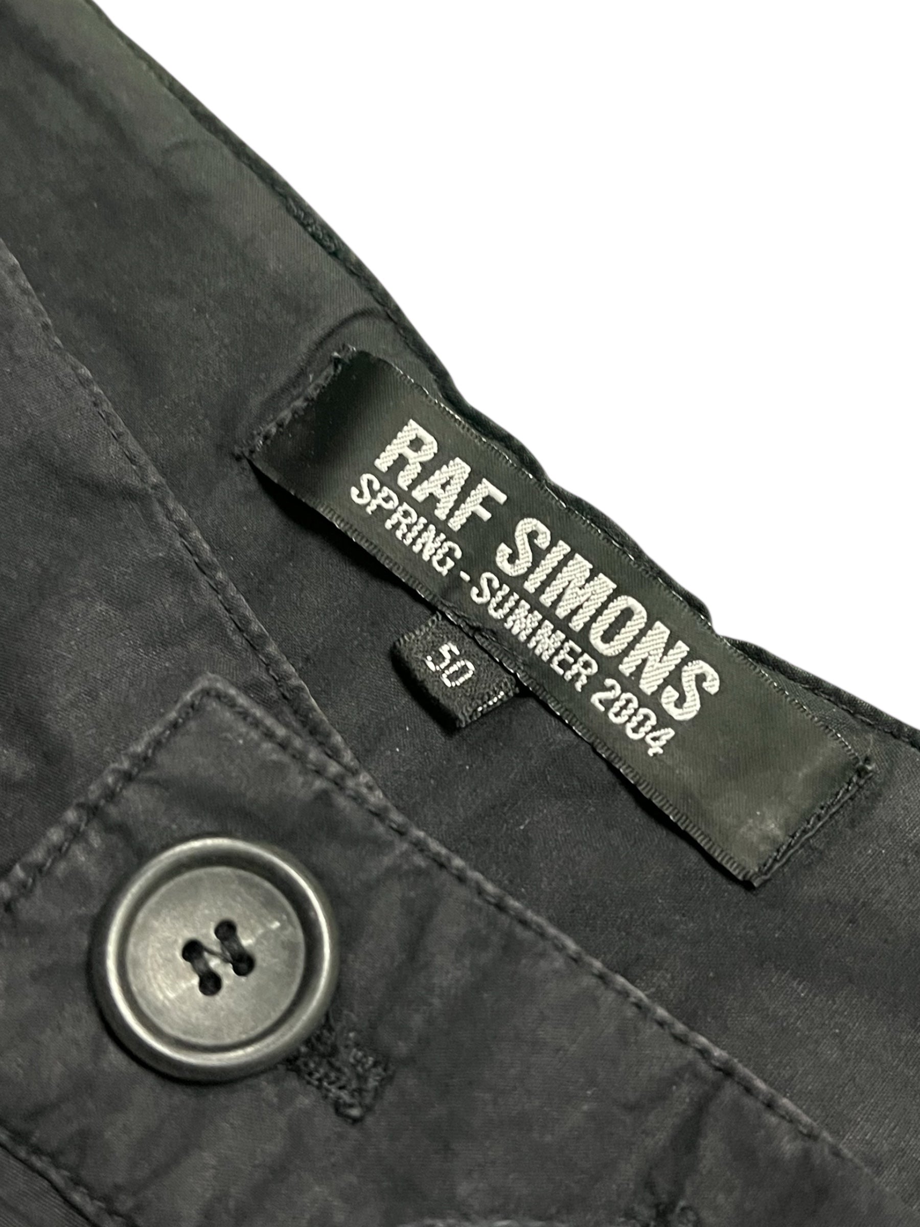 Raf Simons SS04 "May The Circle Be Unbroken" zombie pants featuring distressed fabric and edgy design details.