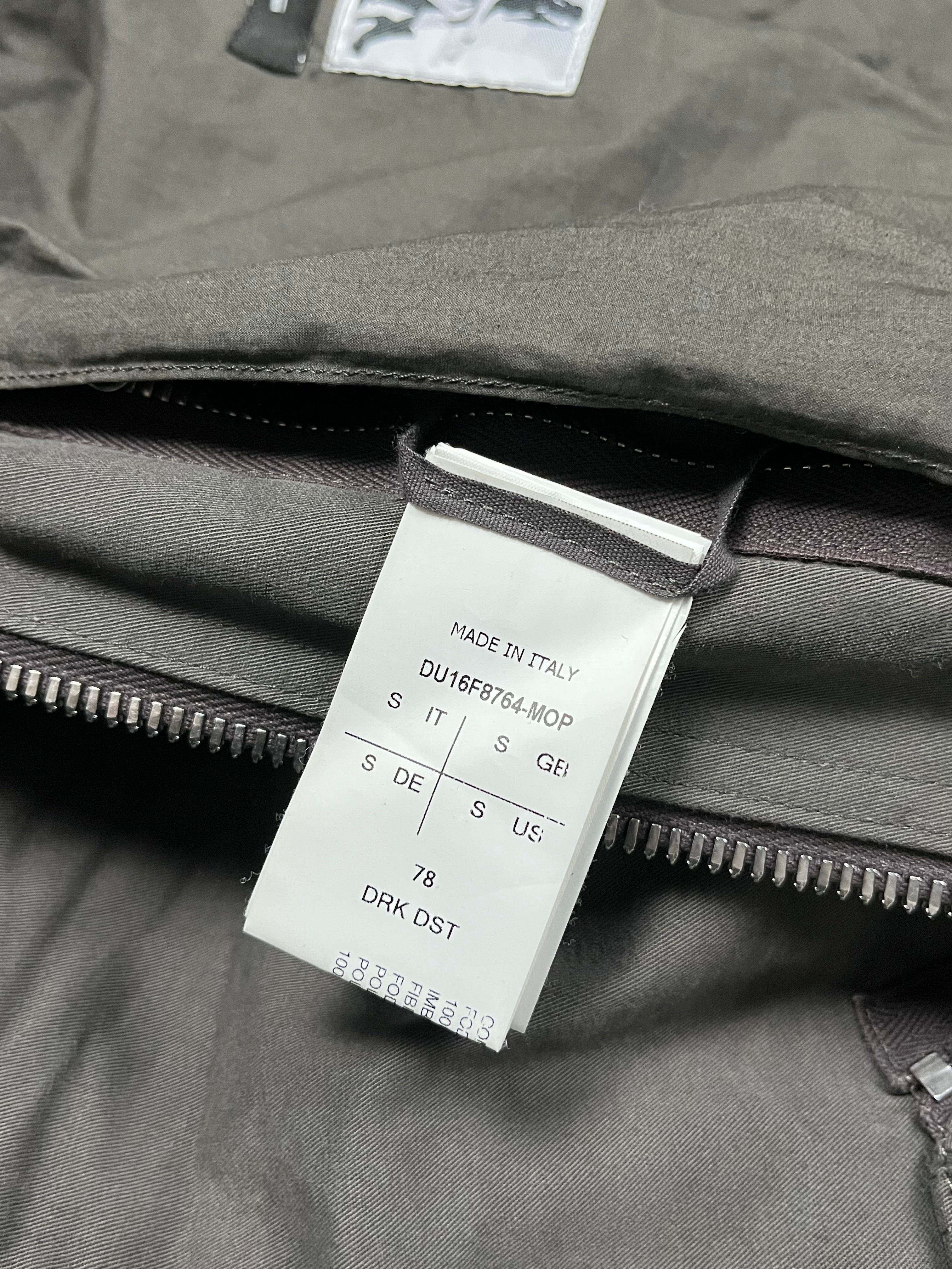 Rick Owens FW16 DRKSHDW Exploder Bomber Jacket displayed on a hanger, featuring dark fabric, ribbed cuffs, and a sleek, modern silhouette.