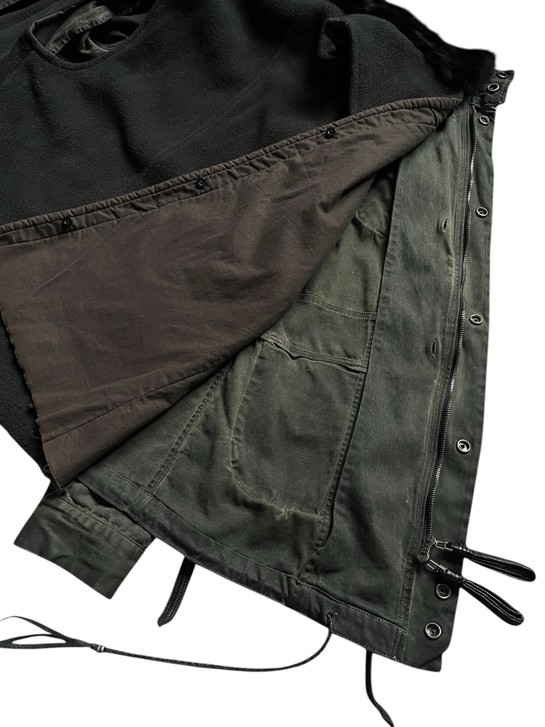 Black Shadow military jacket by KMRii featuring a structured design and button details, styled on a model.