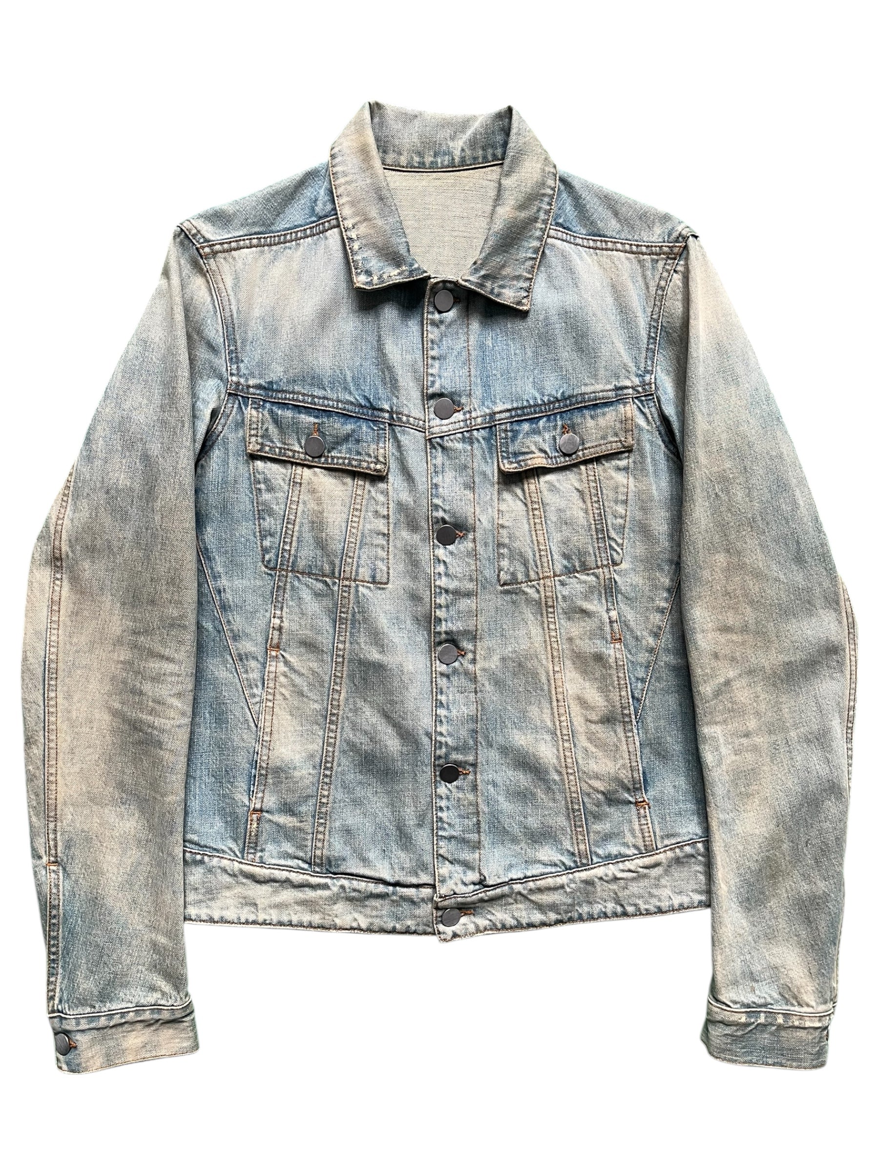 Balmain SS12 G-Dragon Mud Wash Denim Jacket displayed on a hanger with visible distressed details and classic denim styling.