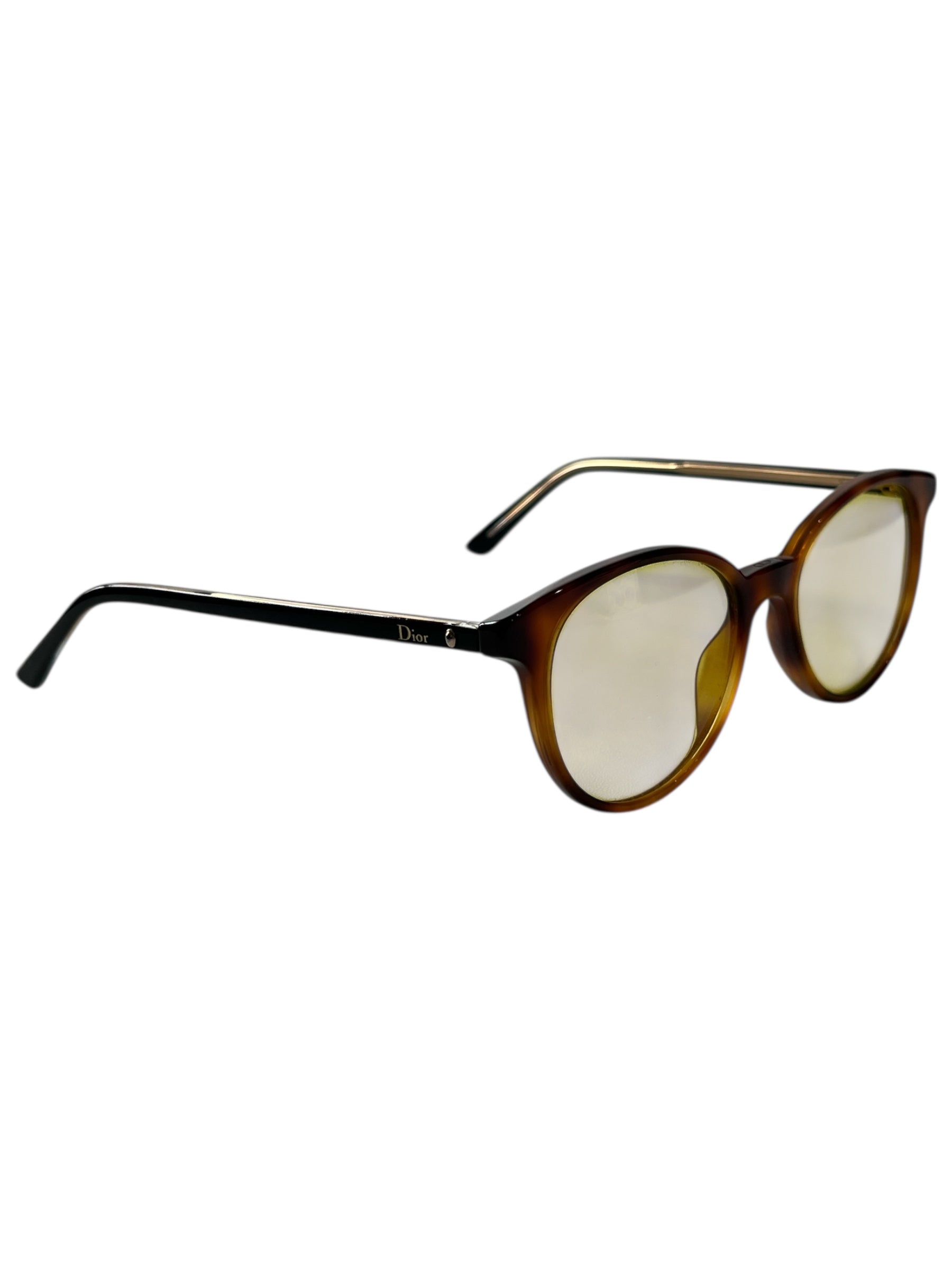 Dior tortoise round sunglasses with brown tinted lenses and classic tortoise shell frame on a white background.