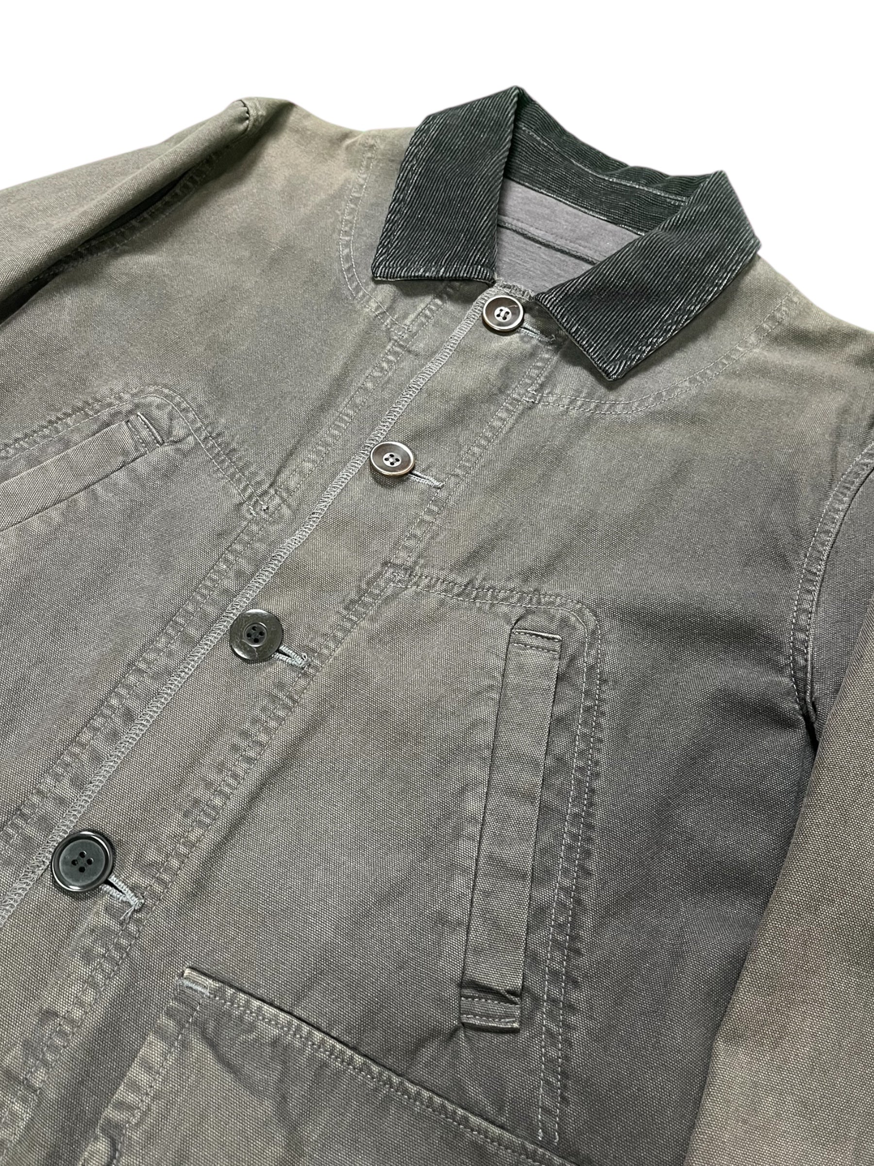 Undercover SS12 Openstrings work jacket with adjustable straps, durable fabric, and utilitarian design for rugged outdoor wear.