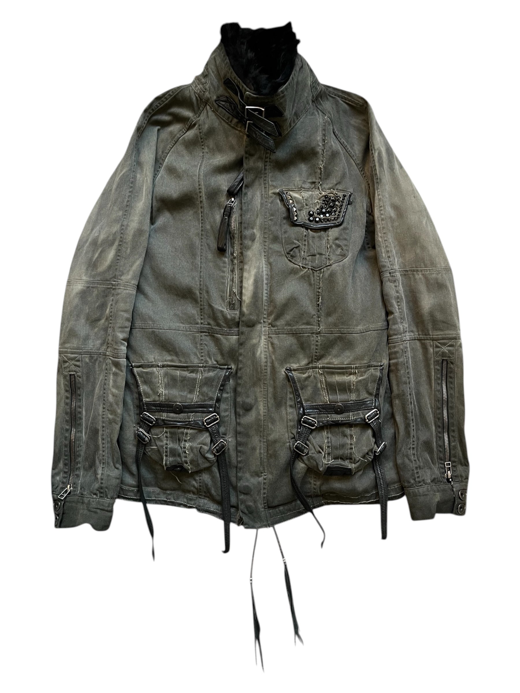 KMRii black shadow military jacket with structured design and tactical details, shown from the front in a neutral setting.