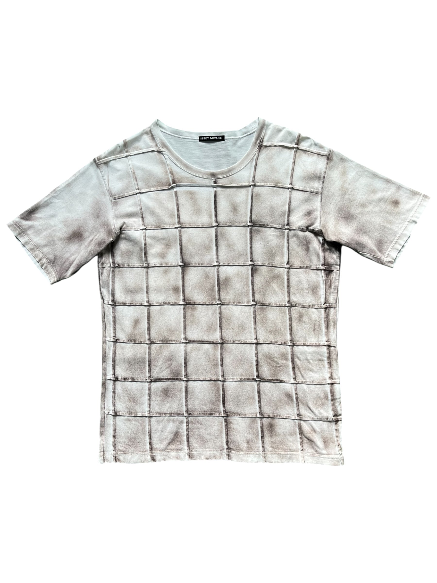 Issey Miyake SS06 quilted effect trompe-l'oeil T-shirt with textured, layered fabric design showing intricate quilting details.