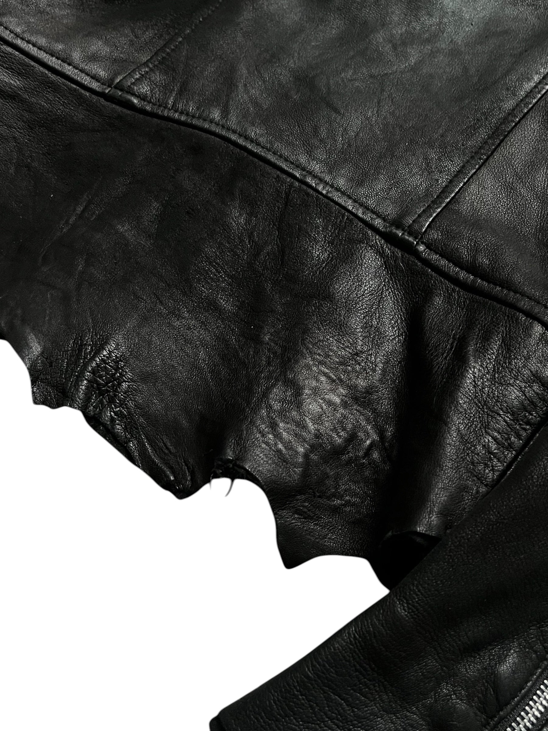 Black sheepskin jacket by 14th Addiction with a cross-zip design, featuring a sleek and stylish outerwear look.