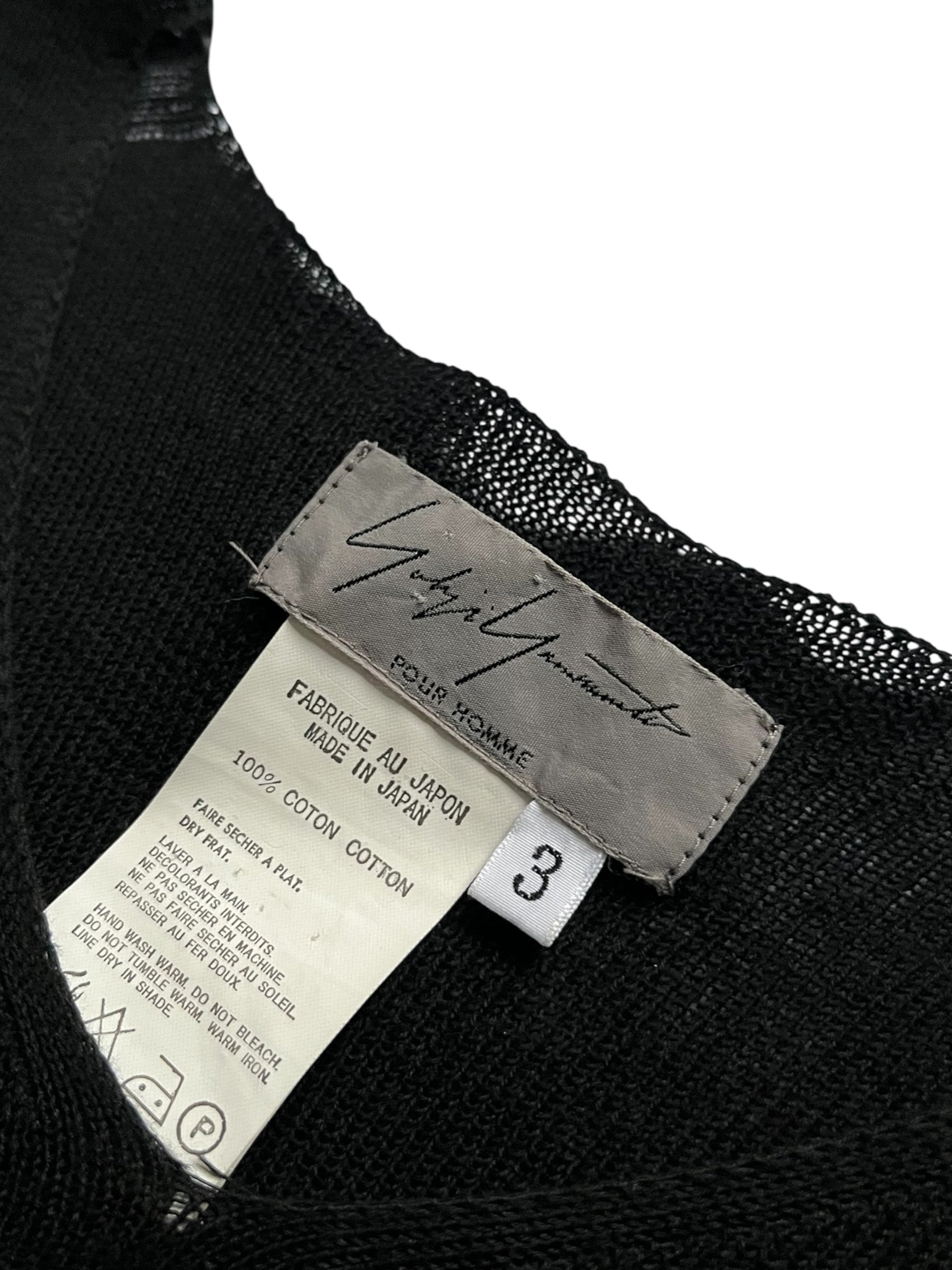 Yohji Yamamoto AW08 knitted tank top in black, close-up showing ribbed texture and sleeveless design.