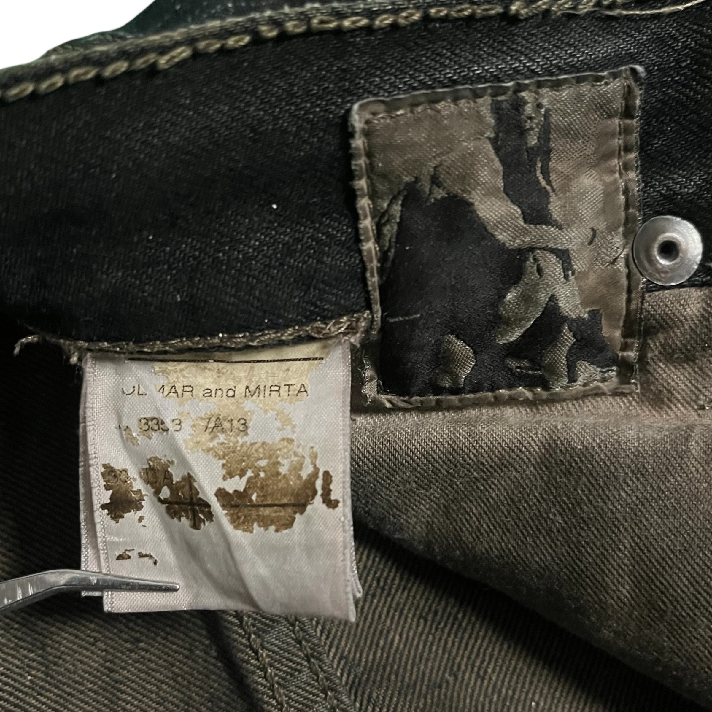 Rick Owens FW08 "Stag" Clawmark denim pants with distressed detailing and unique design elements, front view.