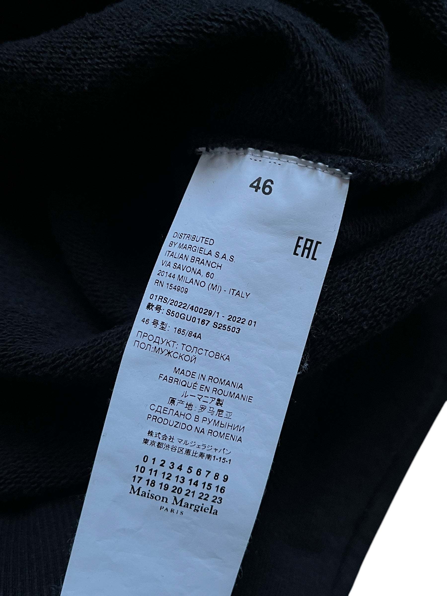 Maison Margiela SS22 Distorted Logo Hoodie showing a close-up of the hoodie with a unique distorted logo design.