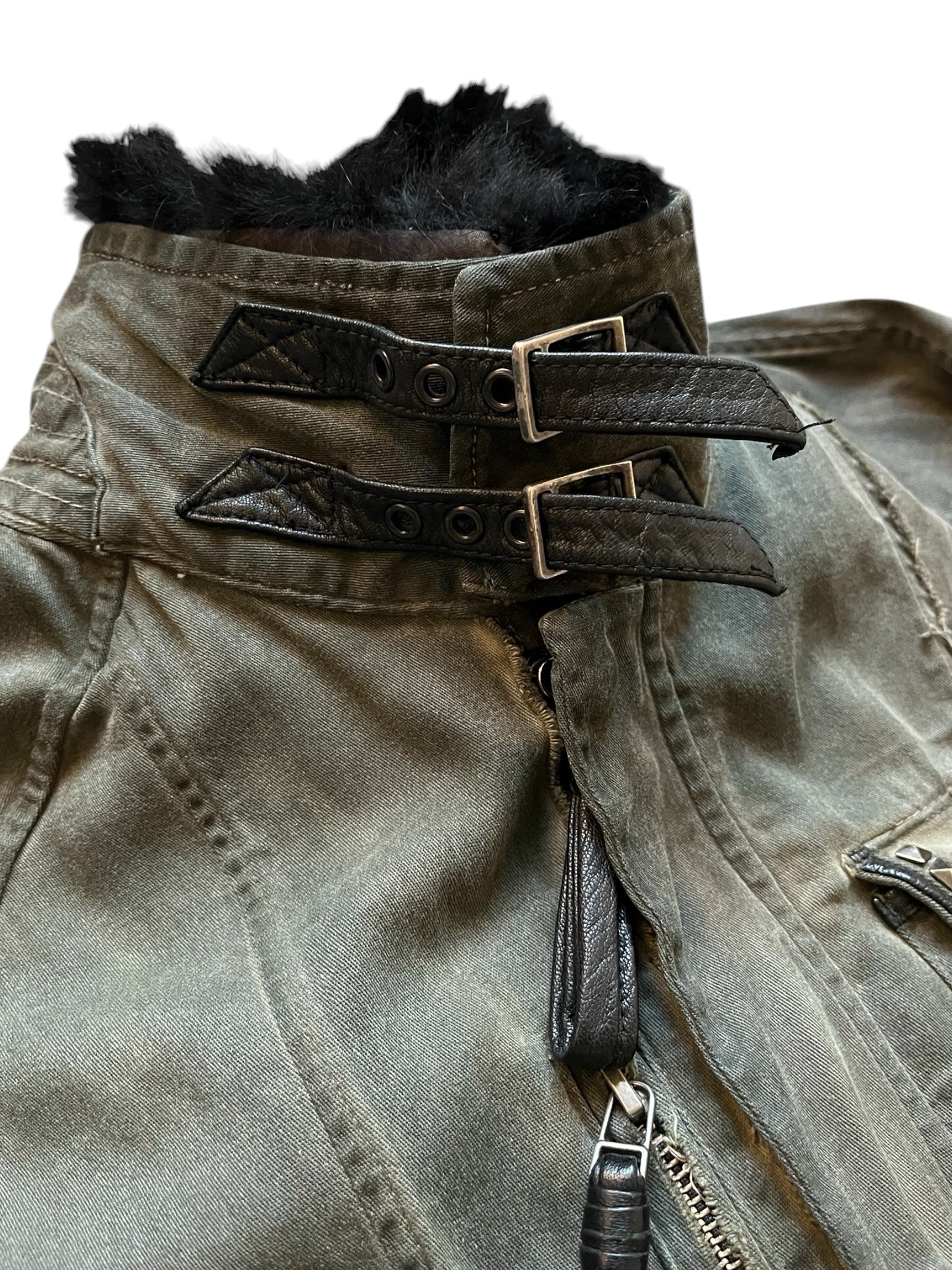 KMRii black shadow military jacket with structured design and button details, displayed on a hanger.