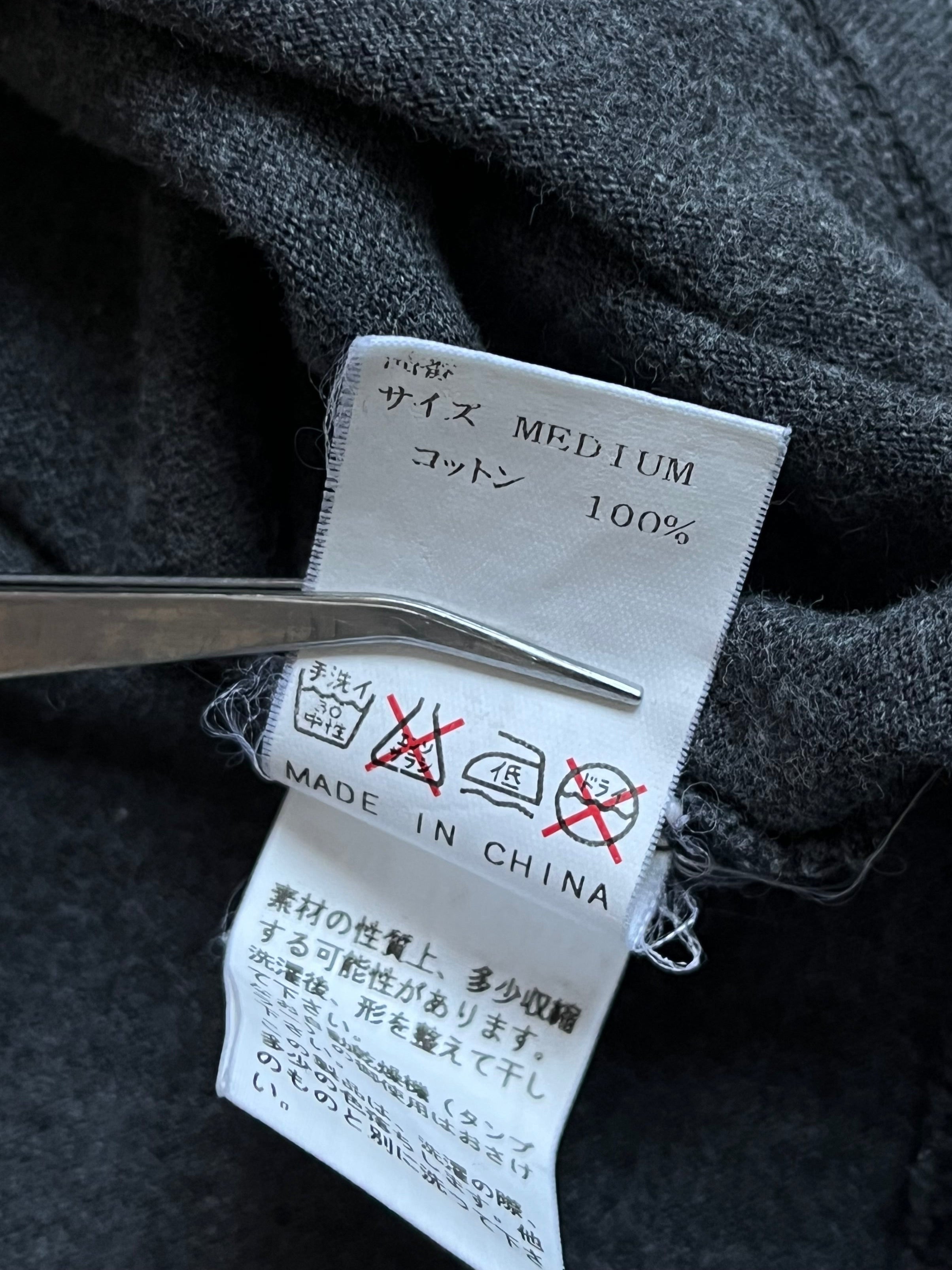 Undercover SS00 "Teaser" WTAPS Generation F*uck You T-shirt displayed on a hanger with graphic print and casual fit.