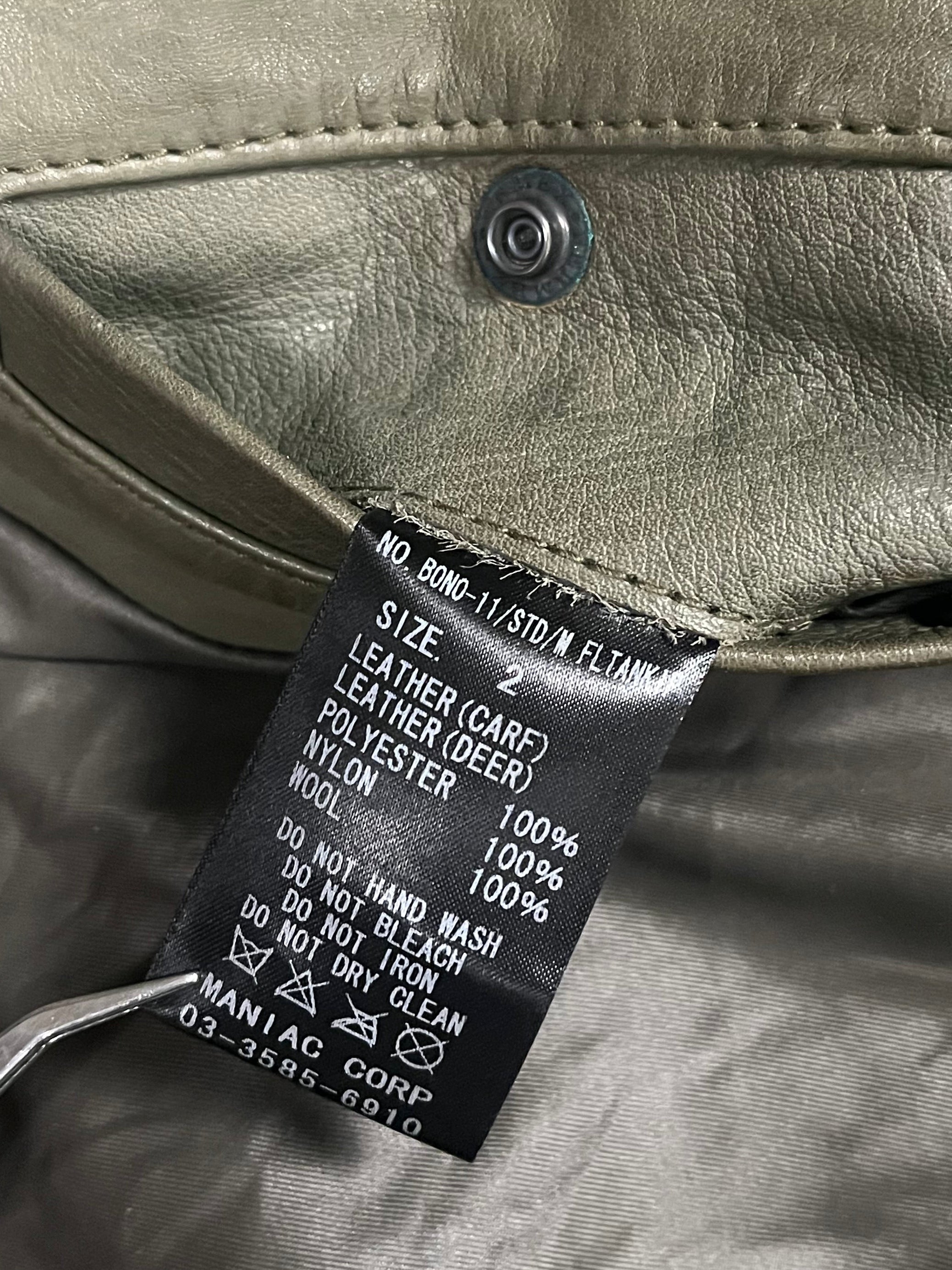Le Grande Bleu green leather jacket inspired by 2000s Bono style, featuring a classic fit and detailed stitching.