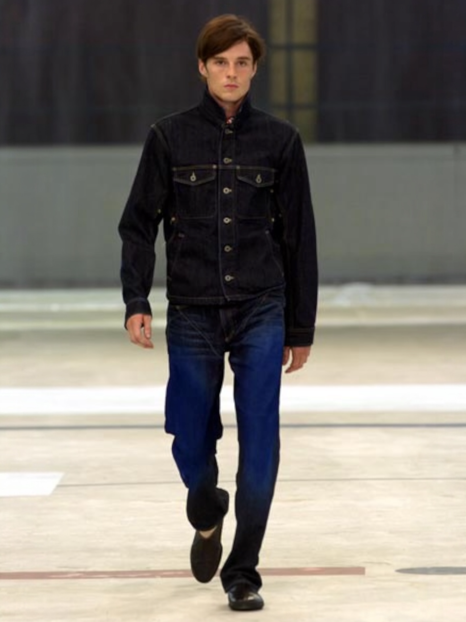 Issey Miyake SS05 runway blue painted denim pants with distressed details and relaxed fit, styled on a runway model.