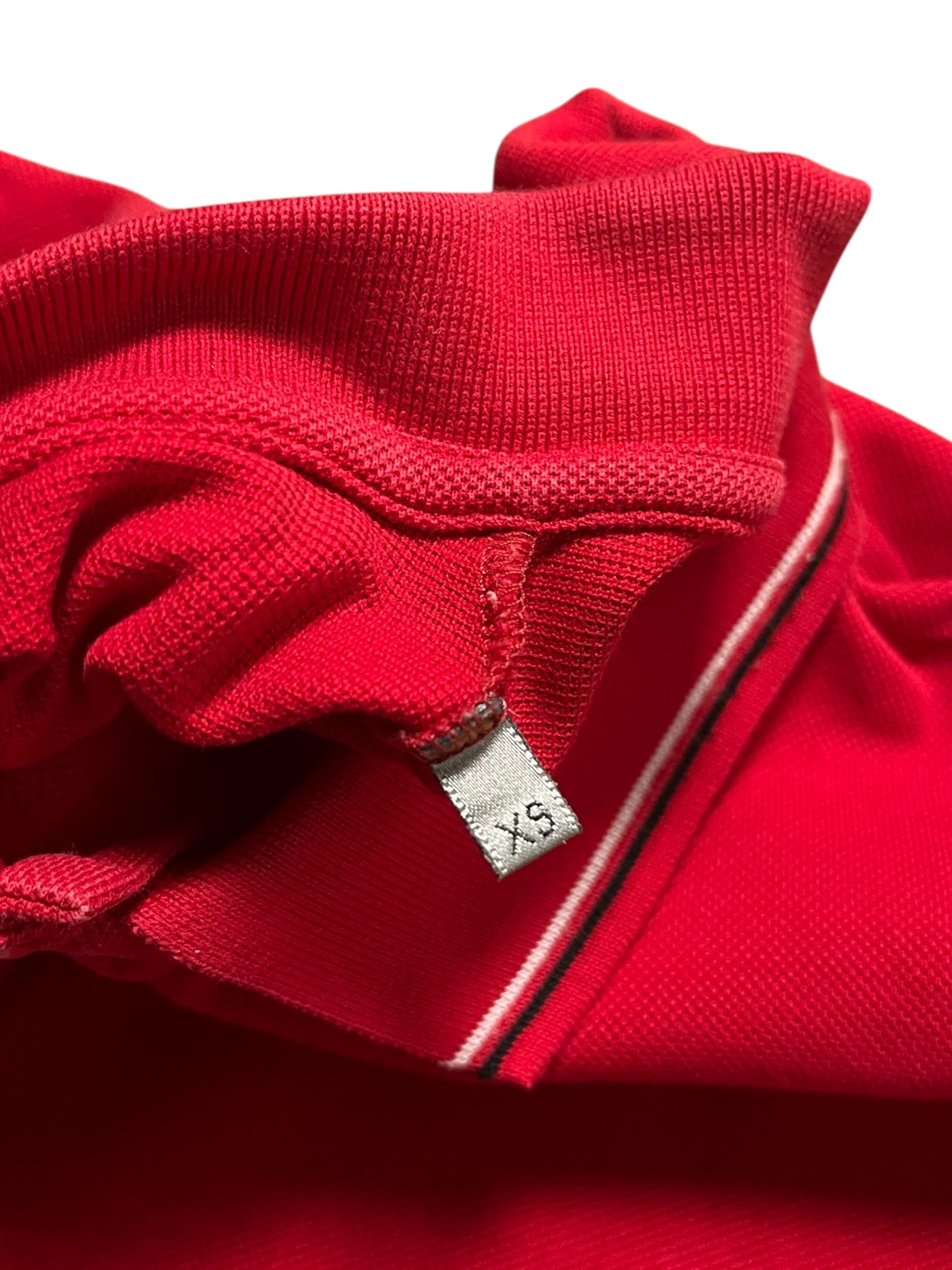 Dior SS06 Pocket Polo shirt in classic polo style with a chest pocket, made from high-quality fabric, displayed on a neutral background.