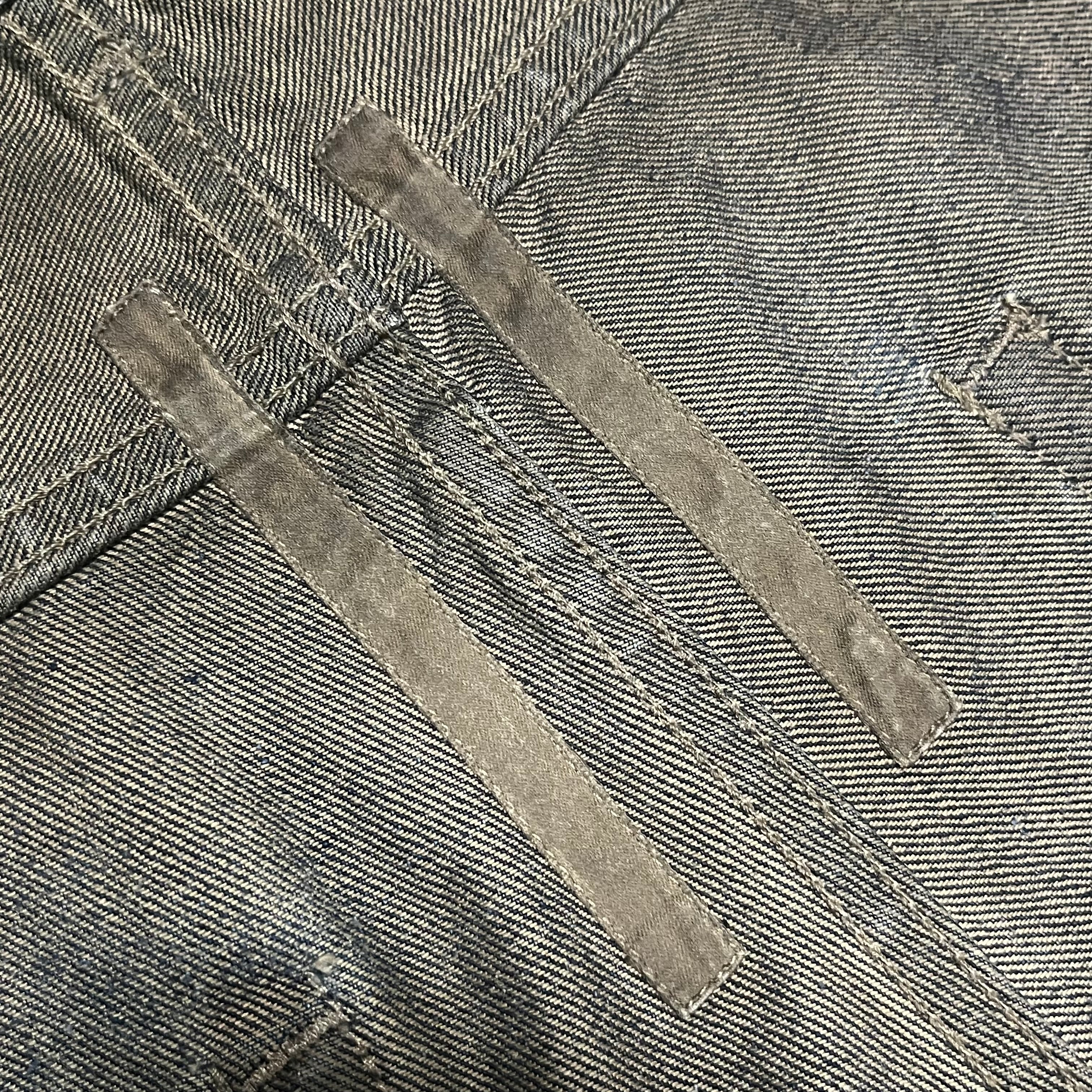 Rick Owens FW08 Stag Clawmark denim pants featuring distressed details and unique design elements.