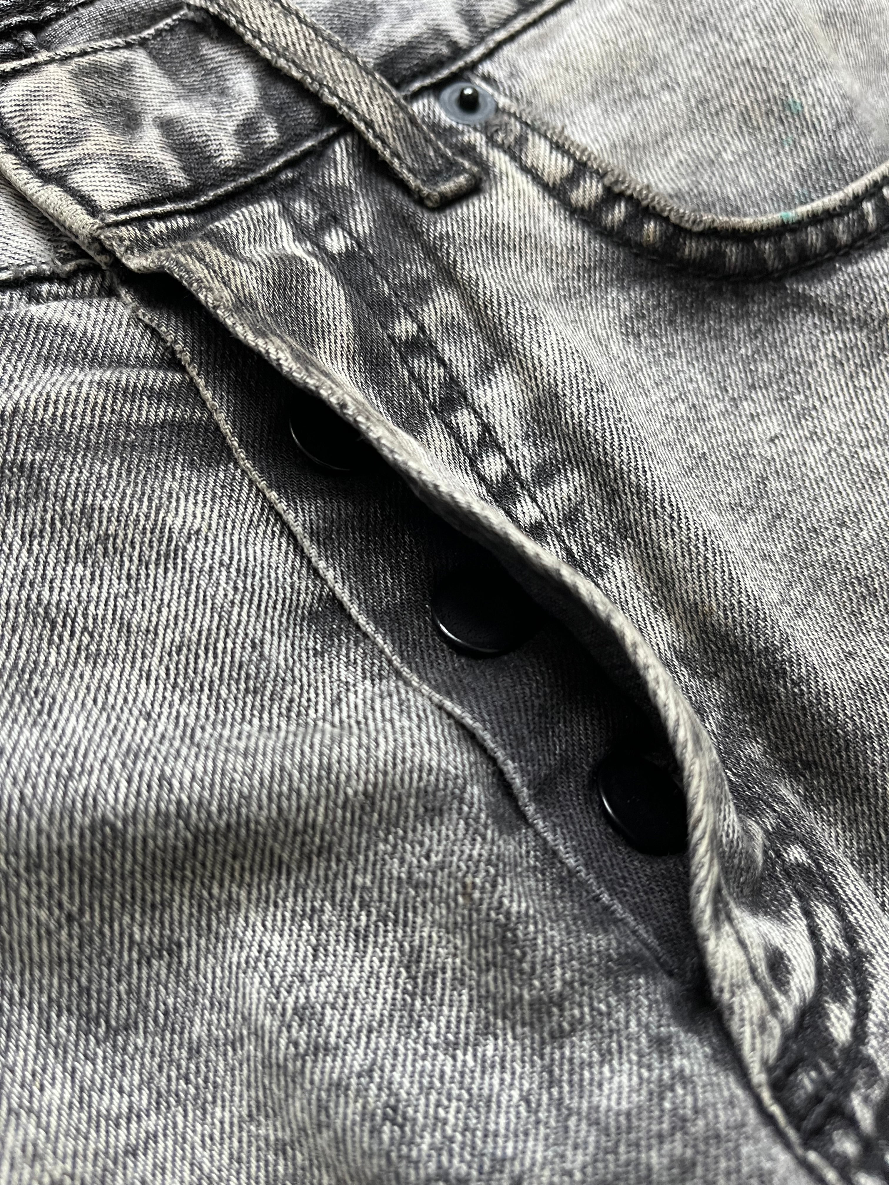 Dior SS15 acid wash slim fit denim pants with distressed detailing and classic five-pocket design.