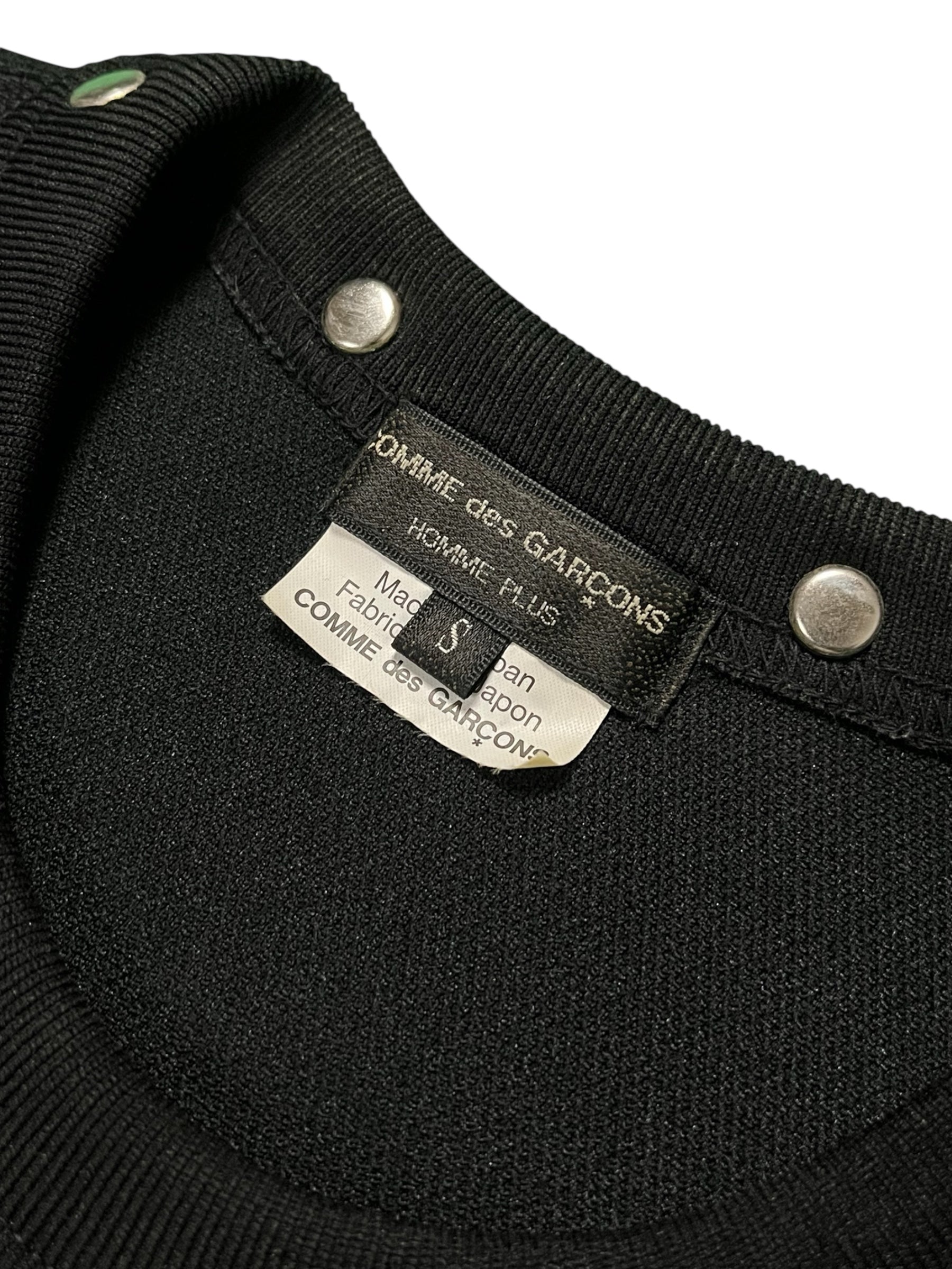 Comme des Garçons Homme Plus Armour Of Peace studded longsleeve shirt with metal studs and detailed design.