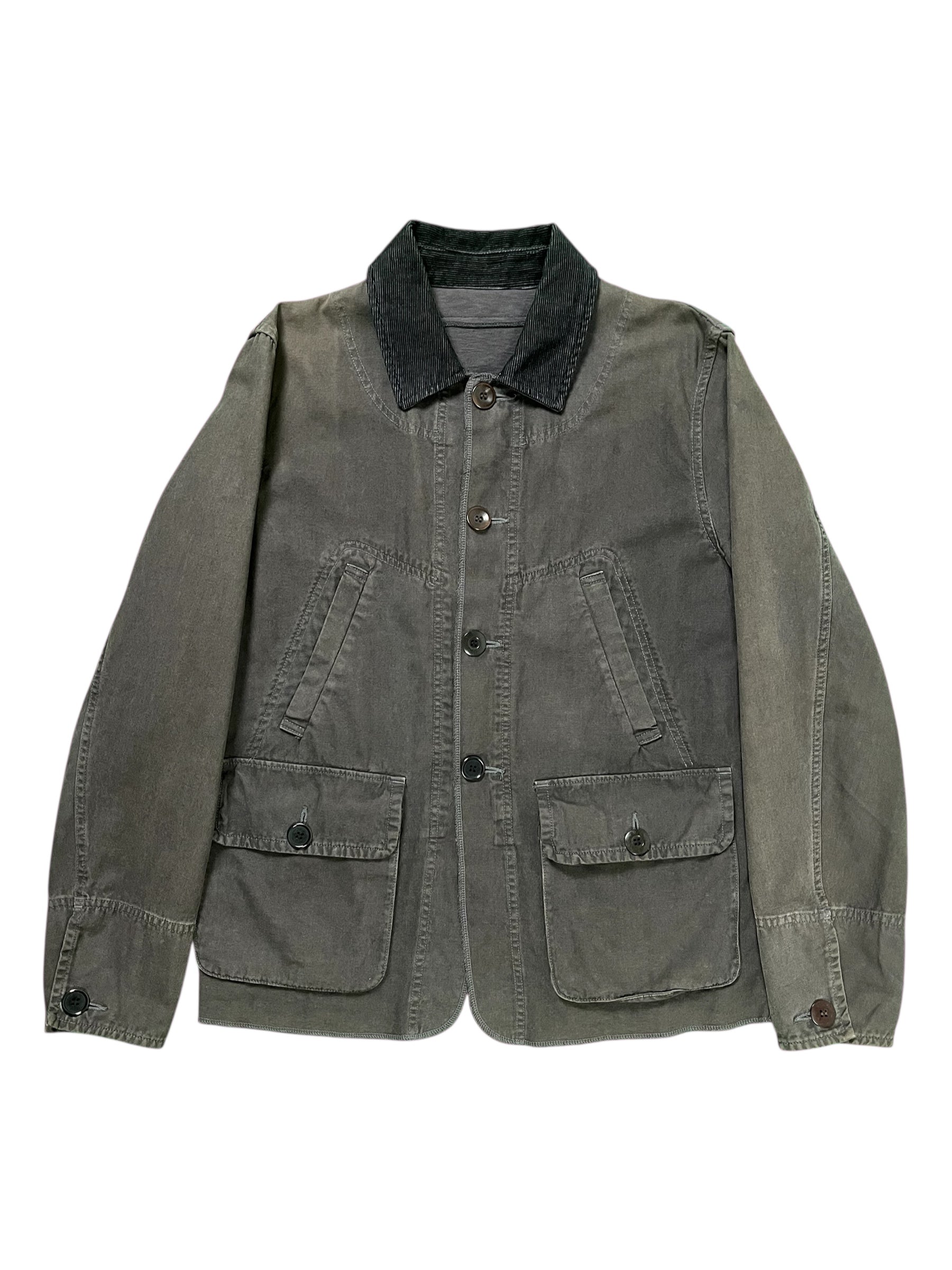 Undercover SS12 "Openstrings" work jacket, black utility jacket with open-string details, front pockets, and rugged fabric.