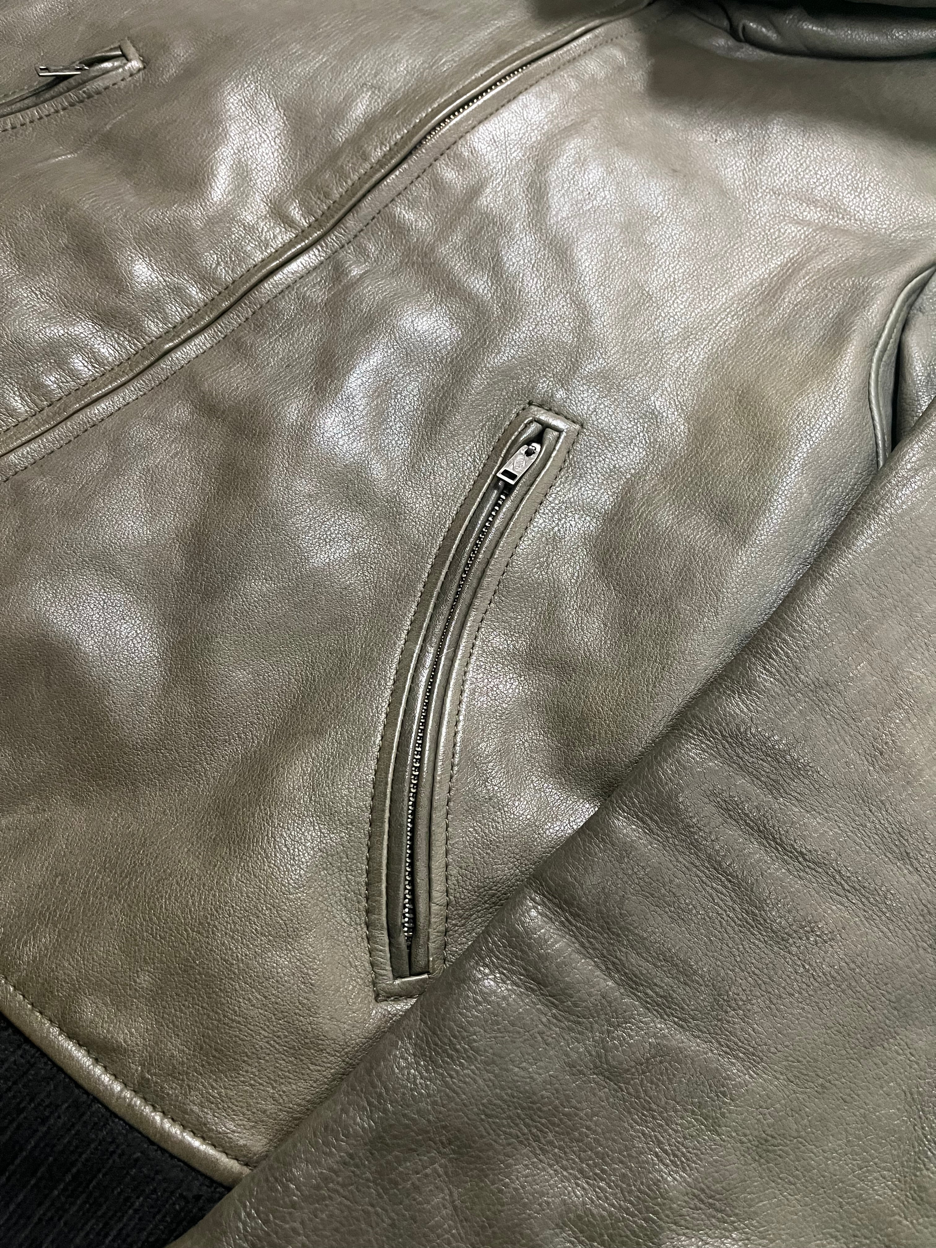 Le Grande Bleu Bono green leather jacket from the 2000s, stylish men's jacket with a sleek design and premium leather texture.