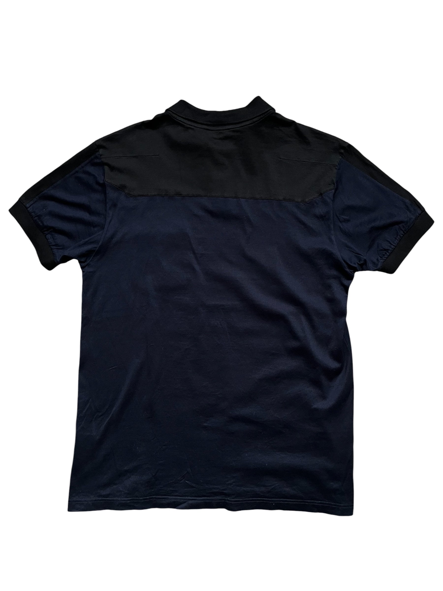 Dior SS07 two-tone pocket polo shirt in navy and white with a chest pocket, classic polo collar, and short sleeves.