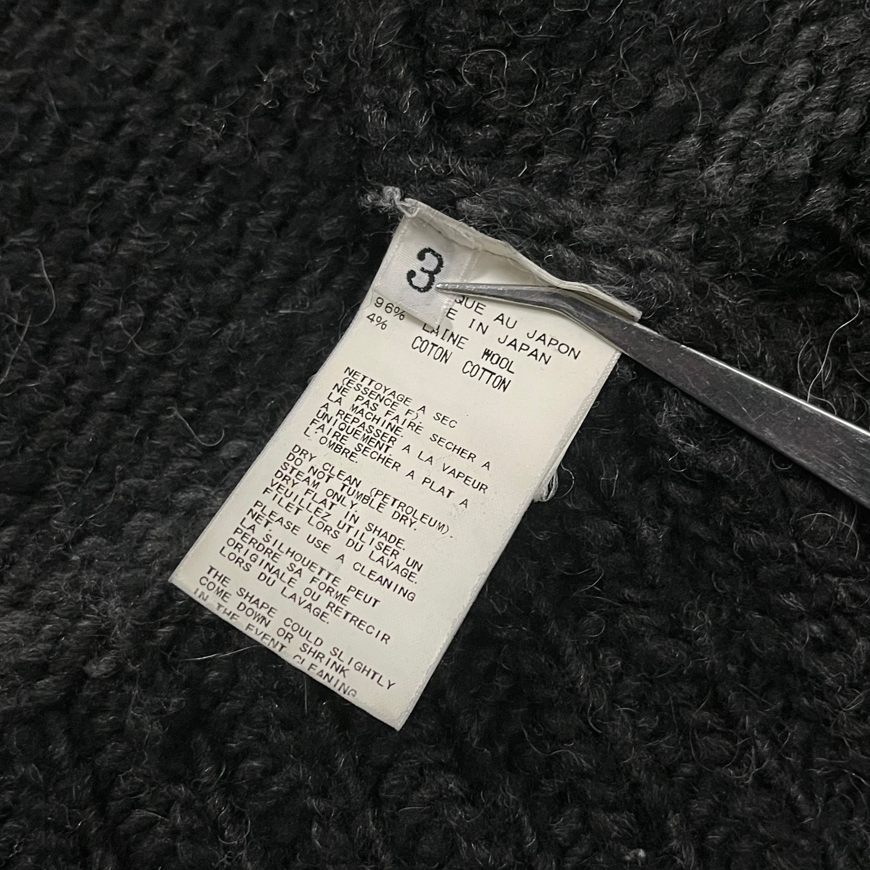 Yohji Yamamoto AW10 Cowichan Knit jacket featuring textured knit fabric and a relaxed fit, displayed on a neutral background.