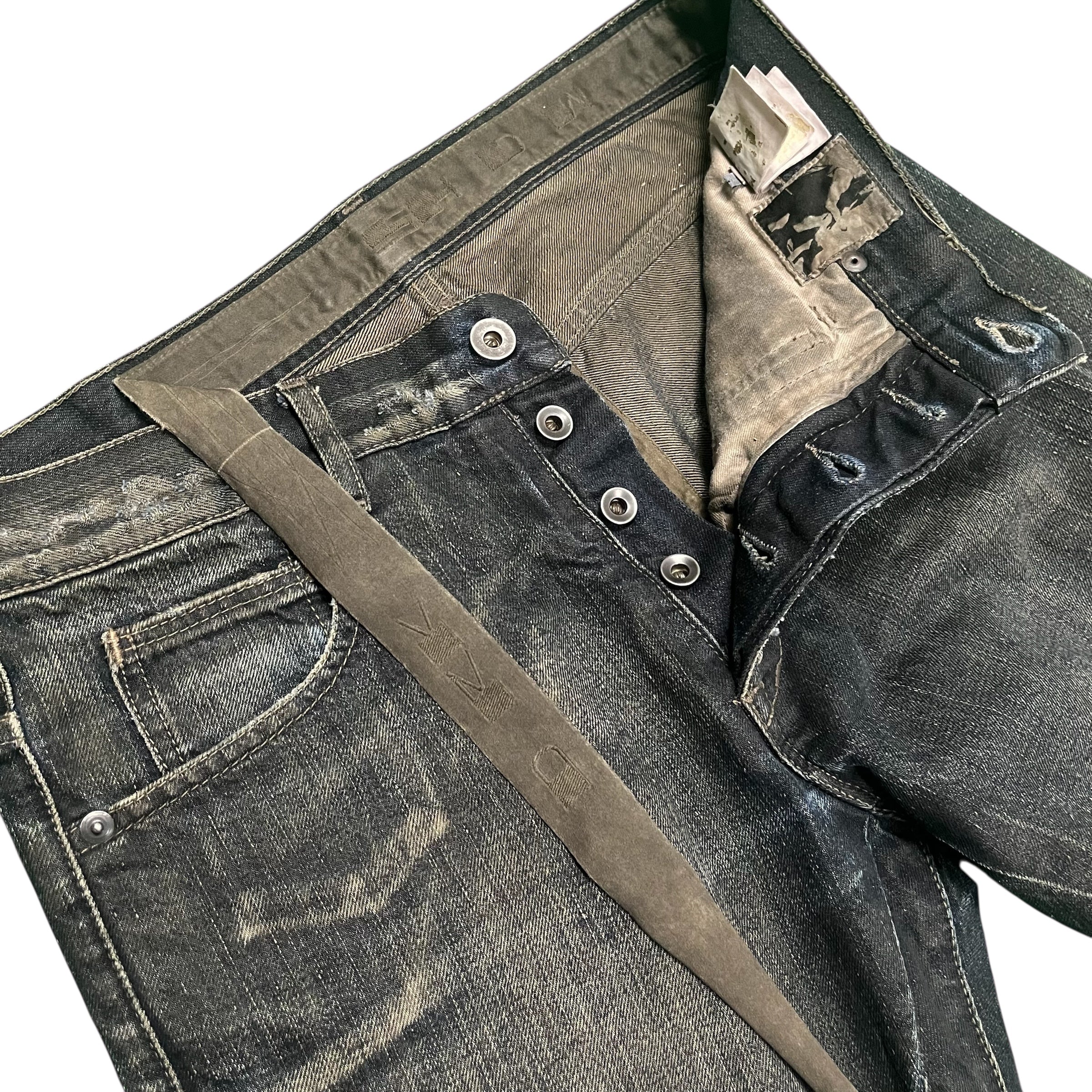 Rick Owens FW08 Stag Clawmark Denim pants featuring distressed denim with unique clawmark details and a tapered fit.