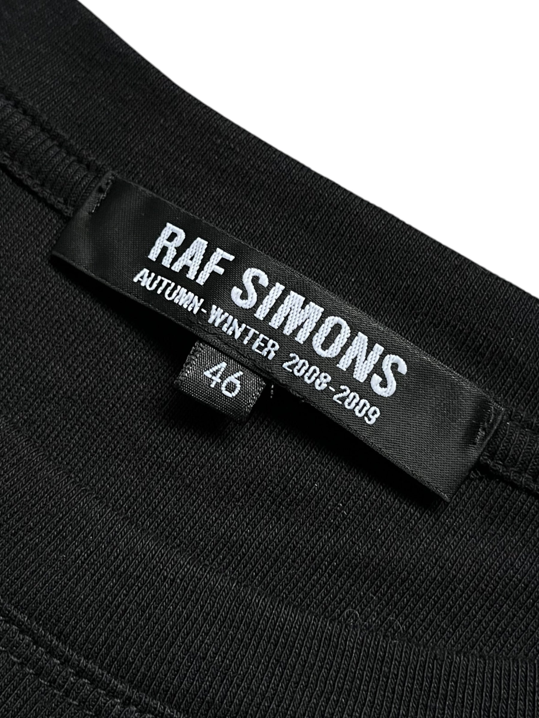 Raf Simons black T-shirt with minimalist design, showcasing a comfortable fit and soft cotton fabric.