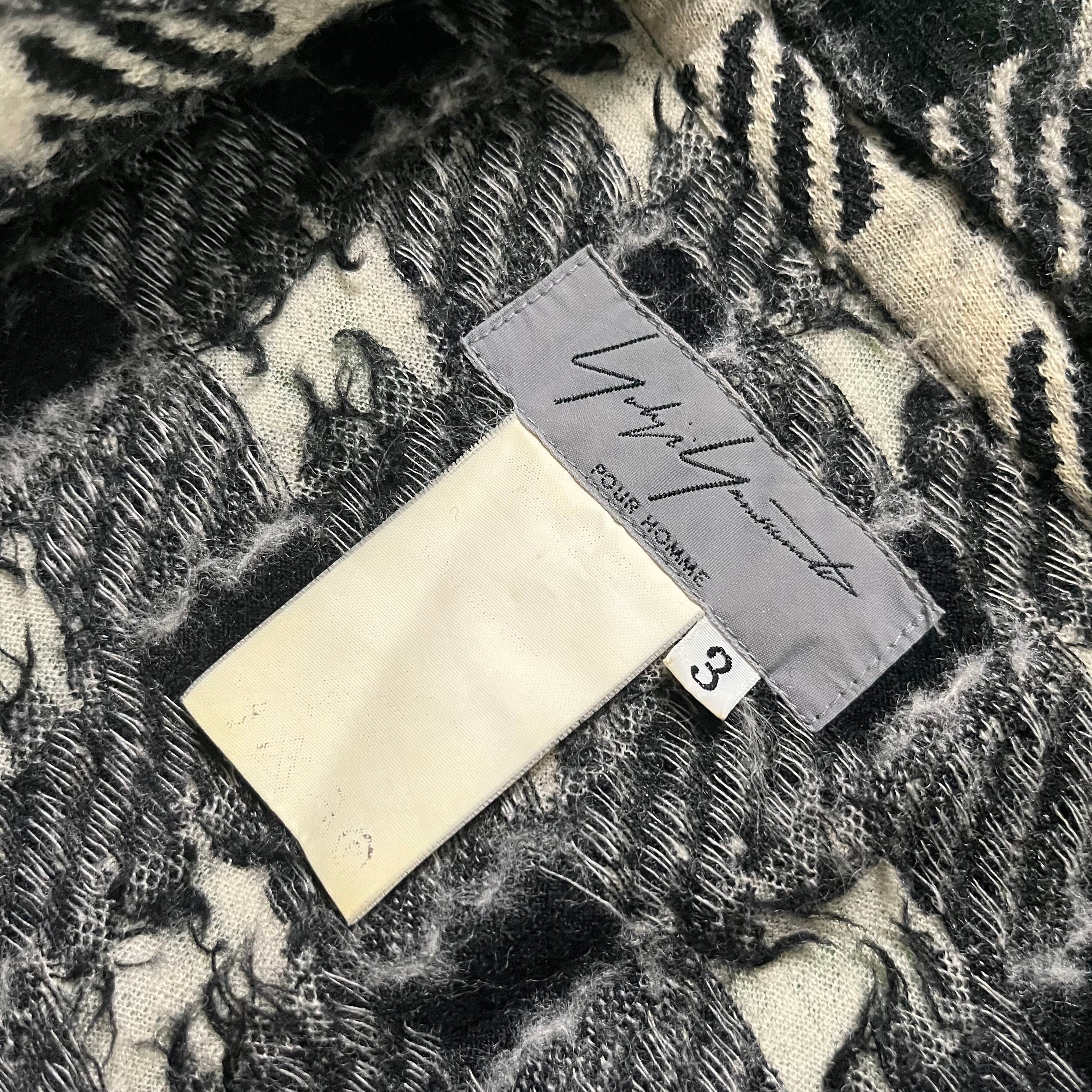 Yohji Yamamoto AW03 checkered wool flannel shirt with black and white pattern, casual long-sleeve design, front button closure.