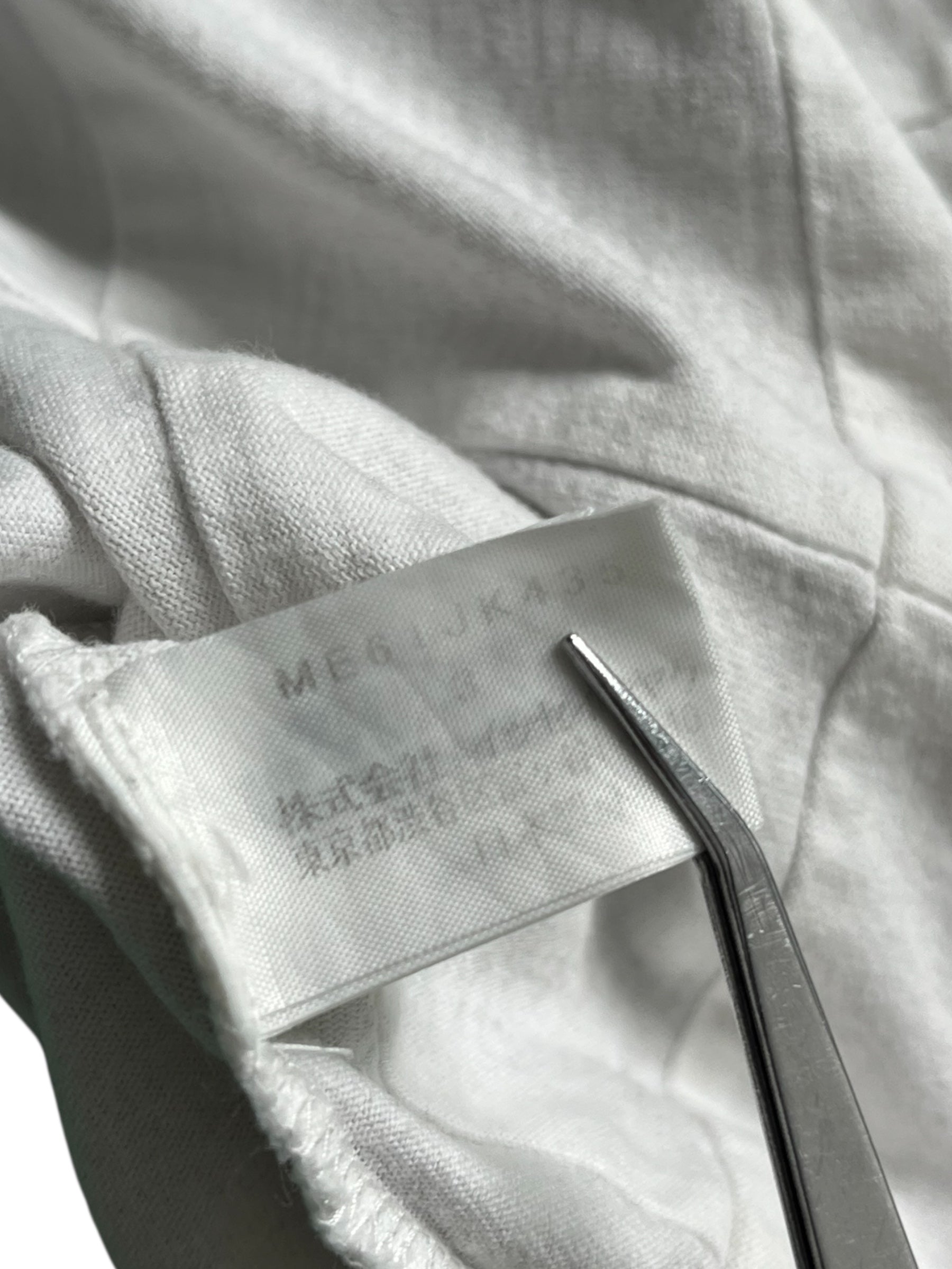 Issey Miyake SS06 quilted effect trompe-l'oeil T-shirt with textured, layered design and modern silhouette.
