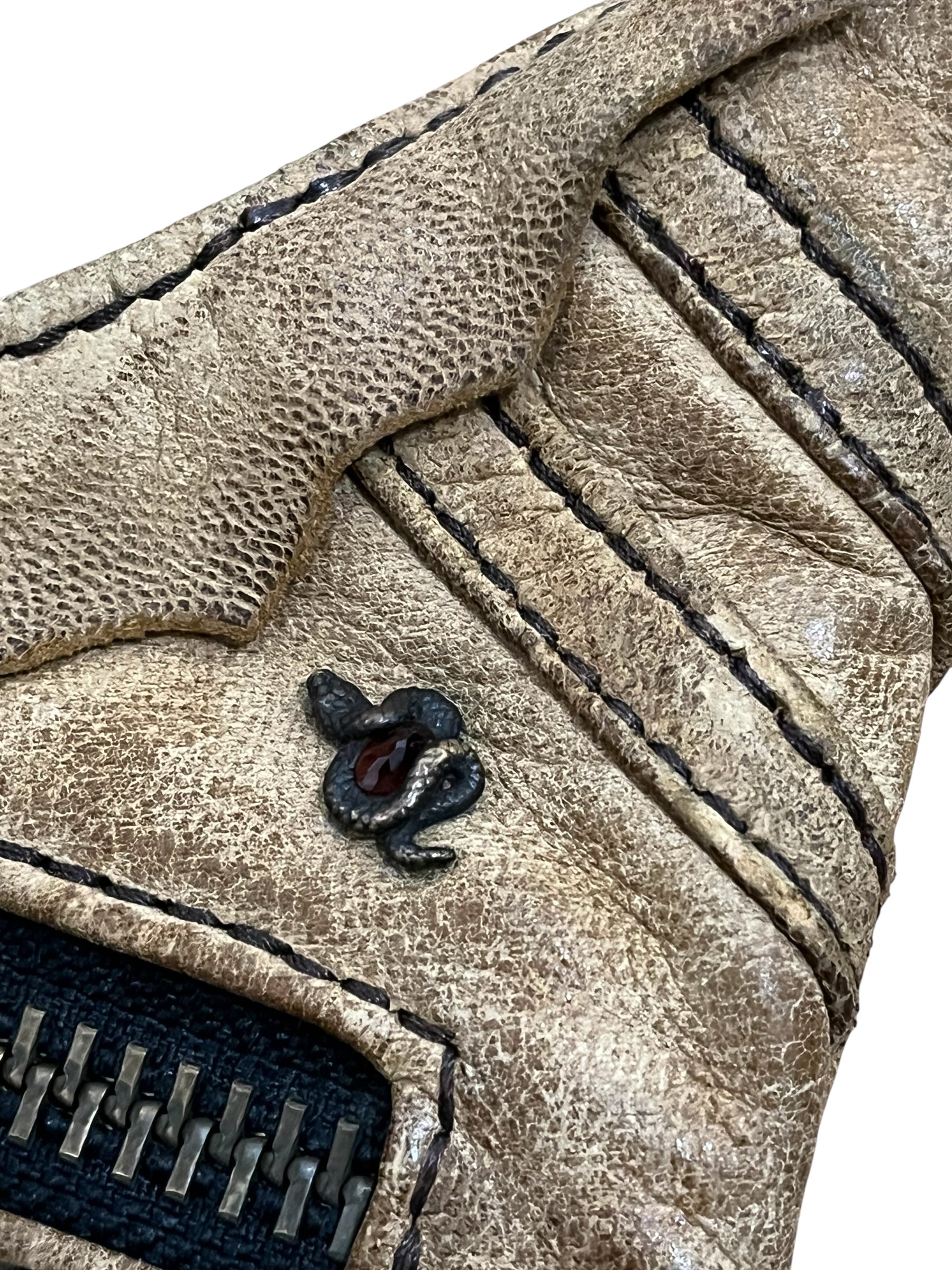 2007 Desert Sand Gun Holster Bag by 14th Addiction attached to a belt, showcasing its compact design and desert sand color.