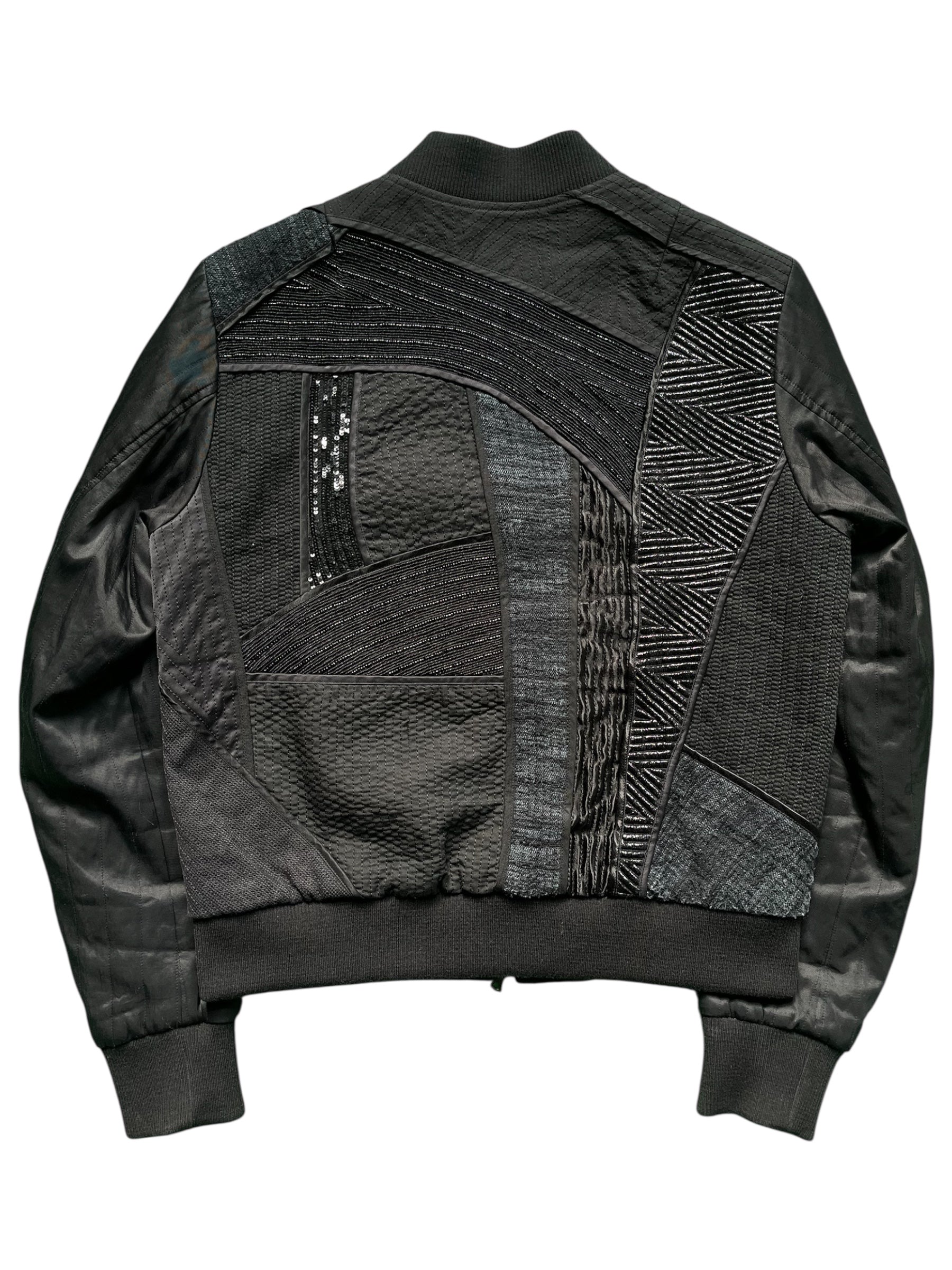 Dries Van Noten SS17 patchwork bomber jacket with mixed fabric panels and ribbed cuffs, front zipper closure, and stylish design.