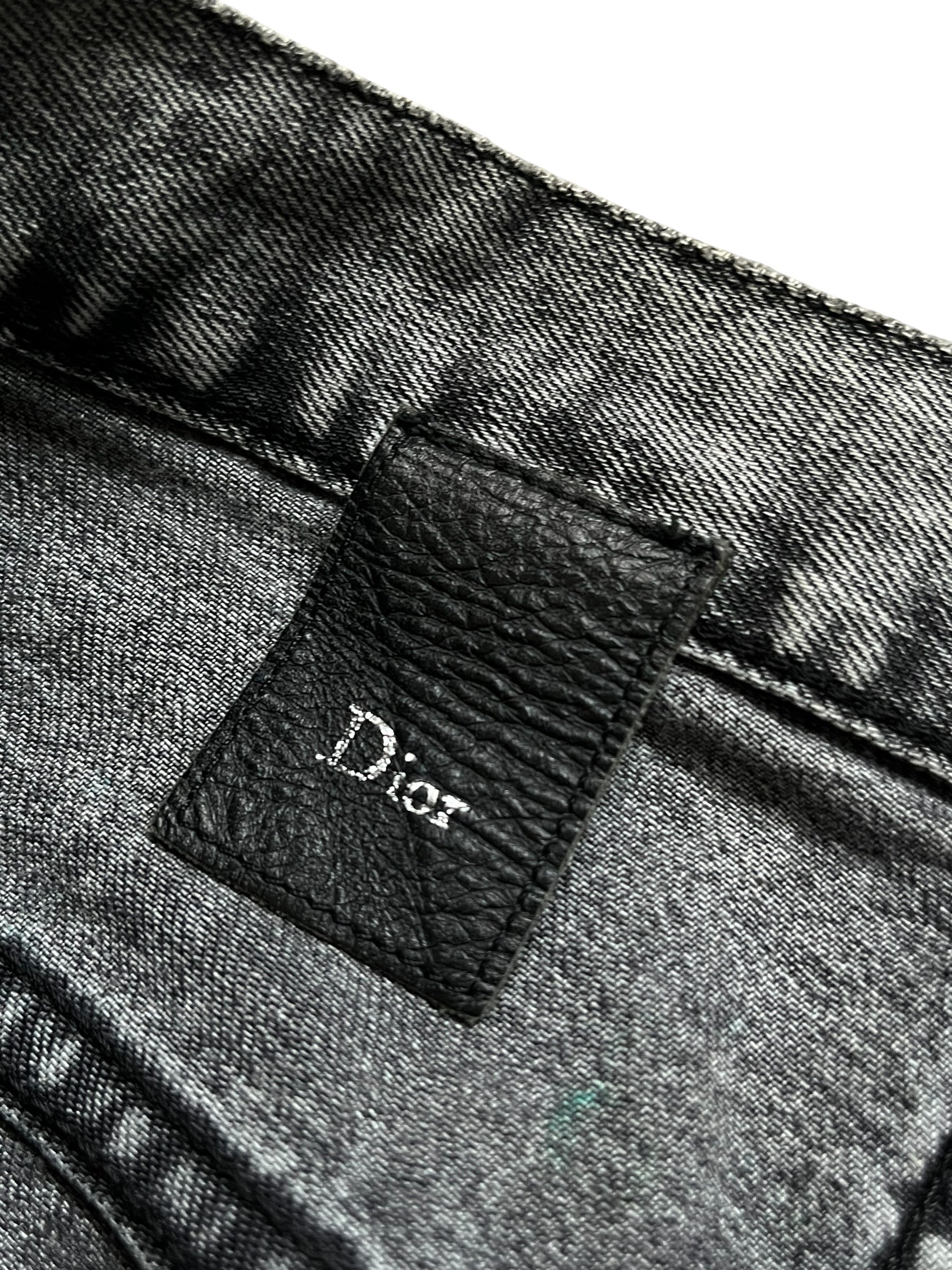 Dior SS15 acid wash slim fit denim pants with distressed detailing and classic five-pocket design.