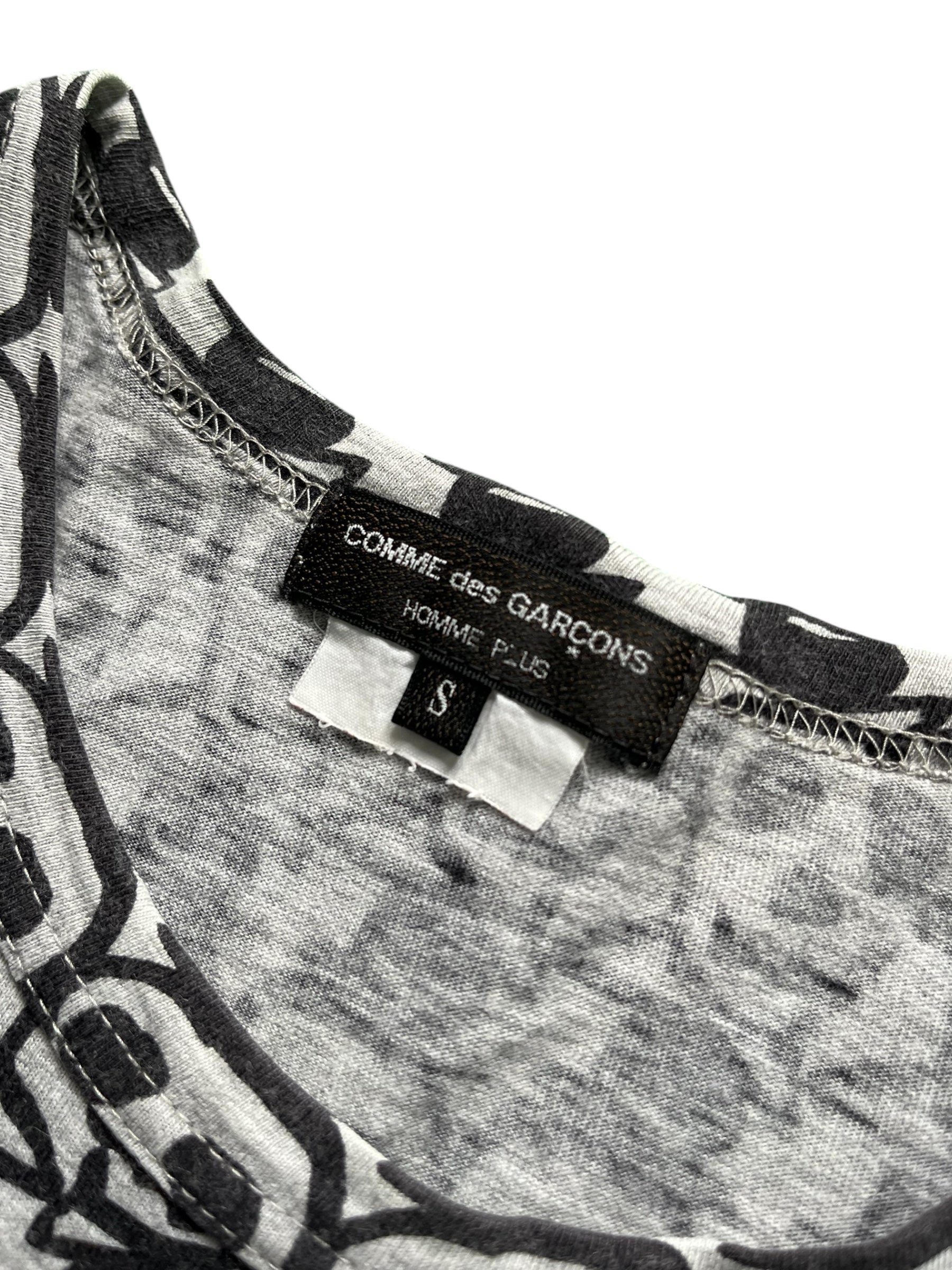 Comme des Garçons Homme Plus SS11 Skull T-shirt featuring a bold skull graphic on black fabric.