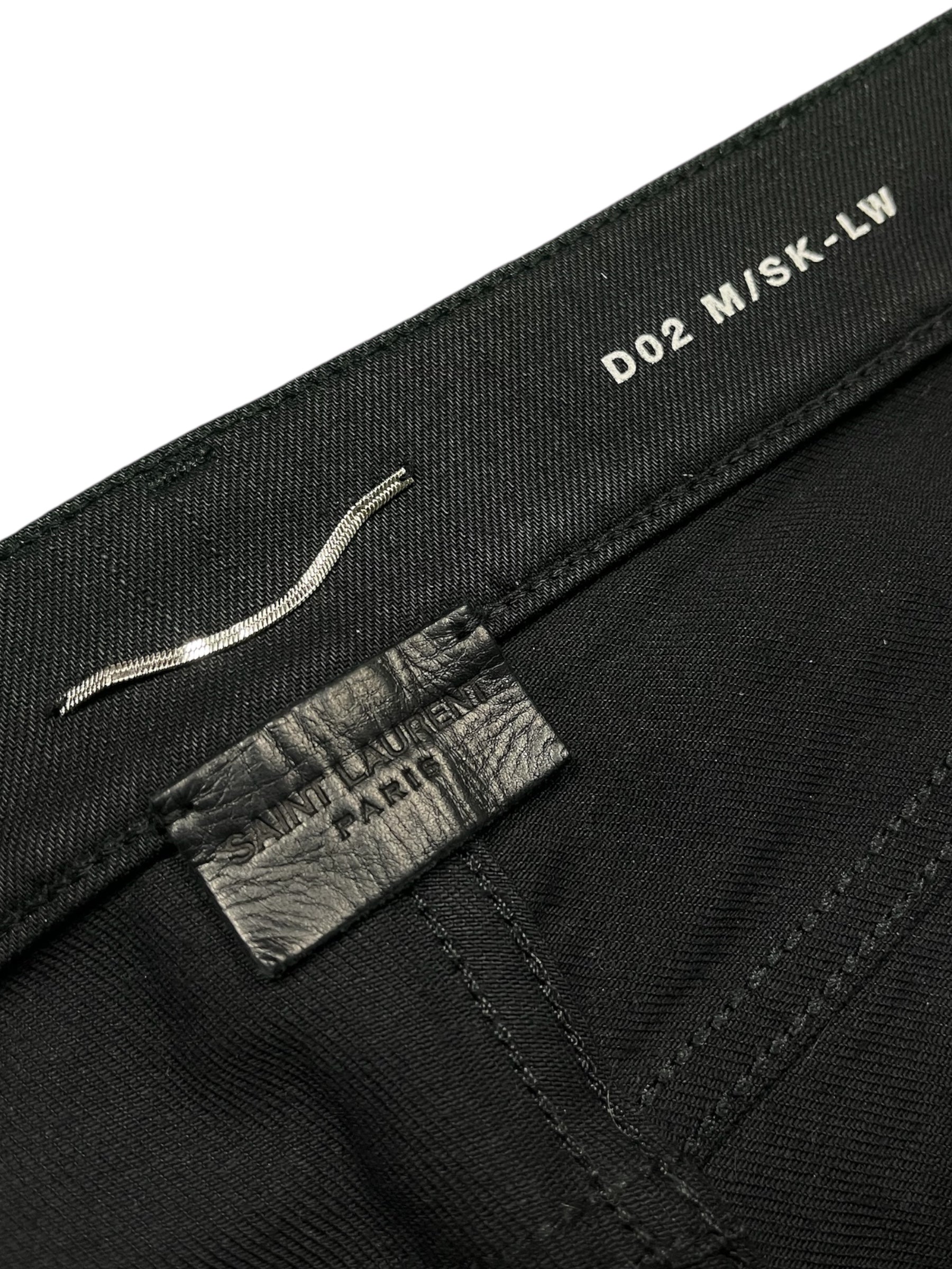 Saint Laurent SS17 D02 waxed cut denim pants showing slim fit design with distressed detailing and classic five-pocket style.