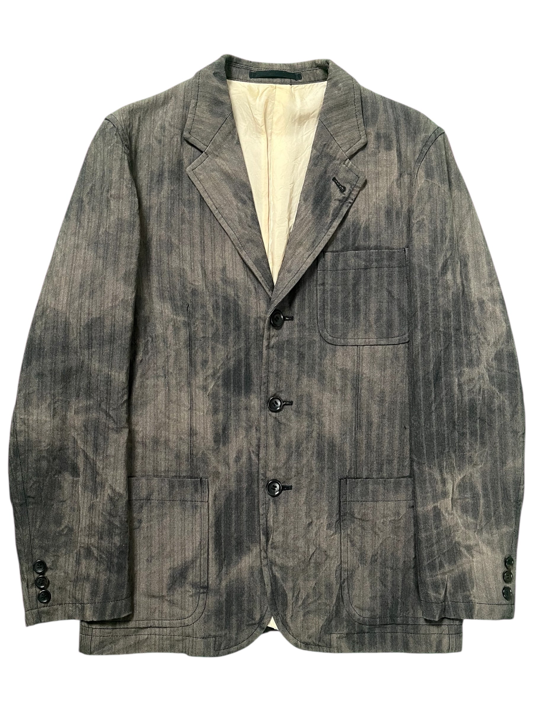 Comme des Garçons Homme SS05 tie dye pleated wool blazer jacket displayed on a hanger with vibrant colors and tailored fit